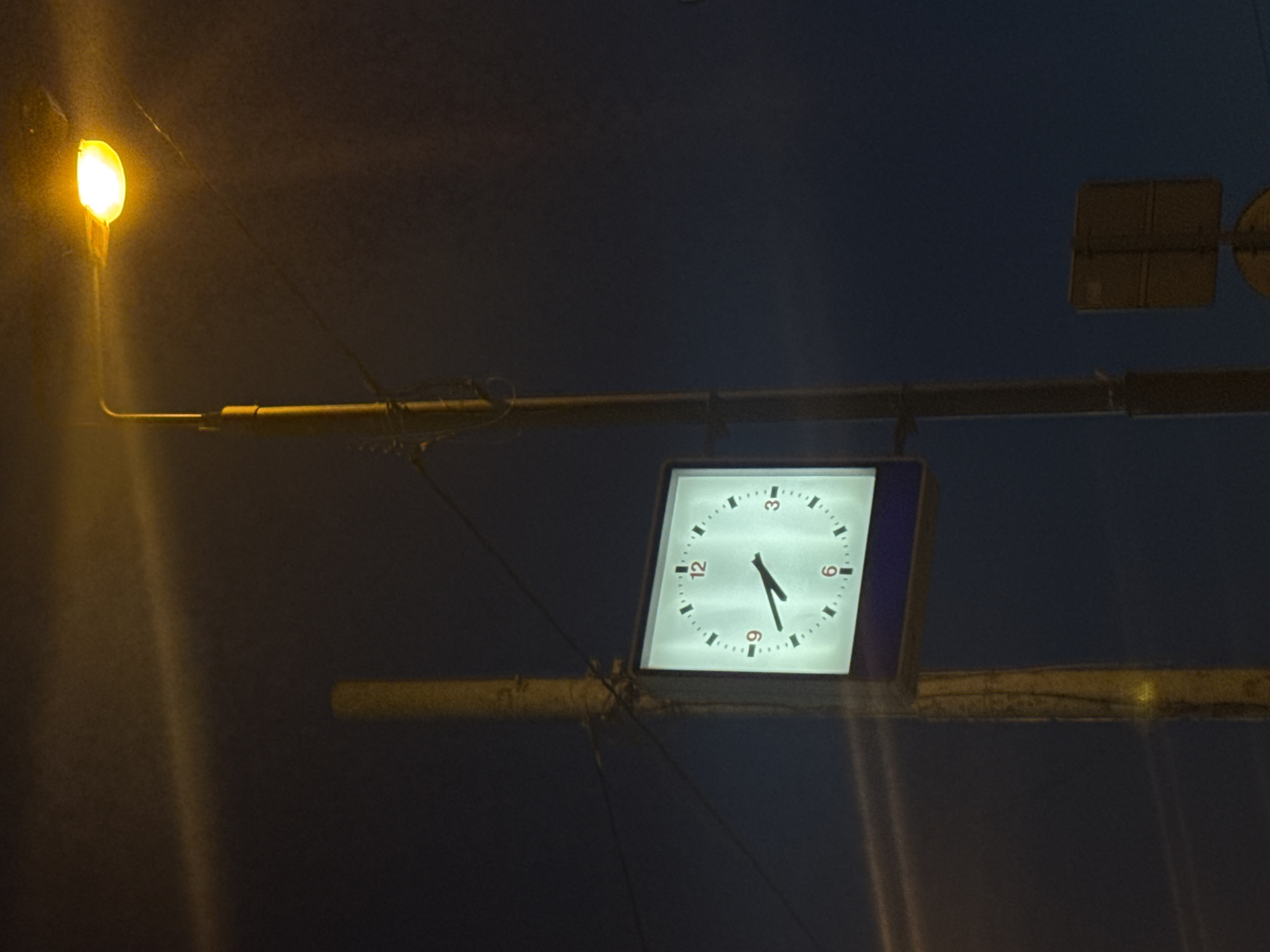 Moscow evening scenes captured at dusk with street clock
