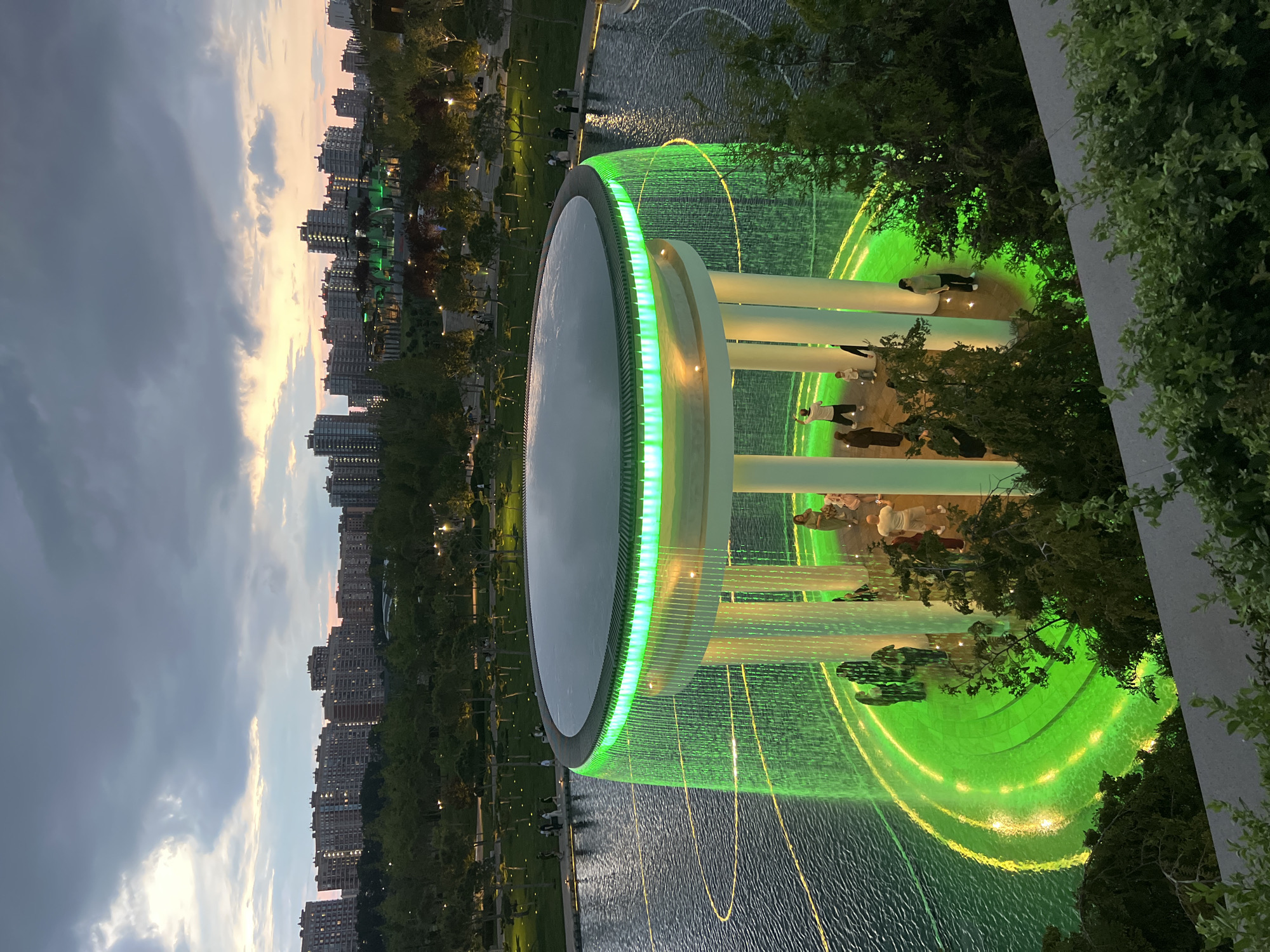 Evening park walk in Krasnodar featuring globe sculpture