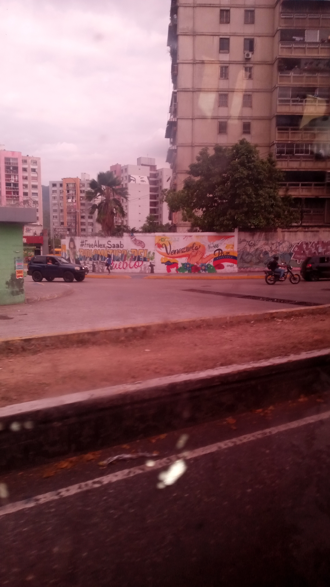 Street scenes documented in Caracas showing political murals, transit