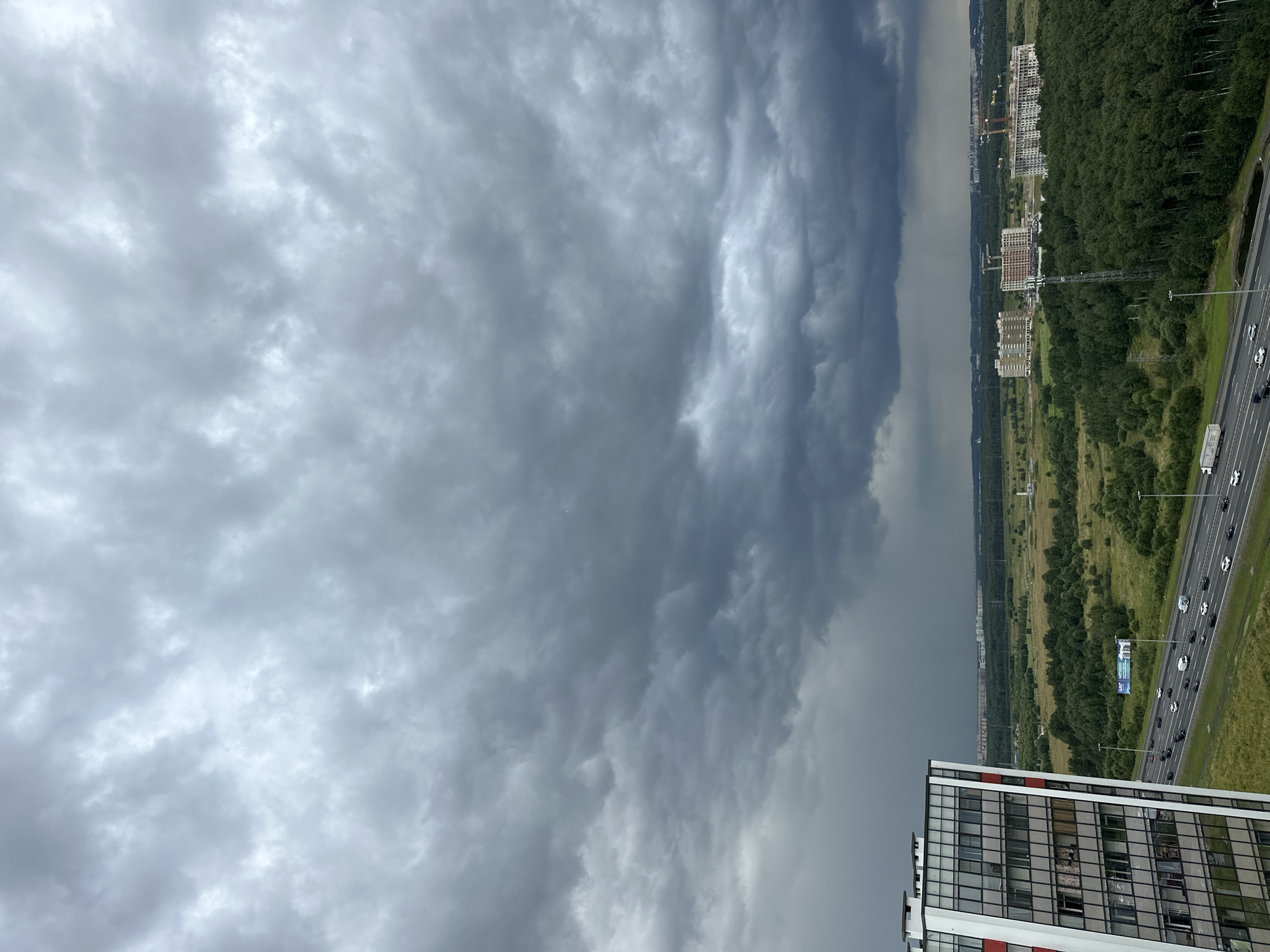 Dark smoke and storm clouds hang over Novosergievka highway corridor