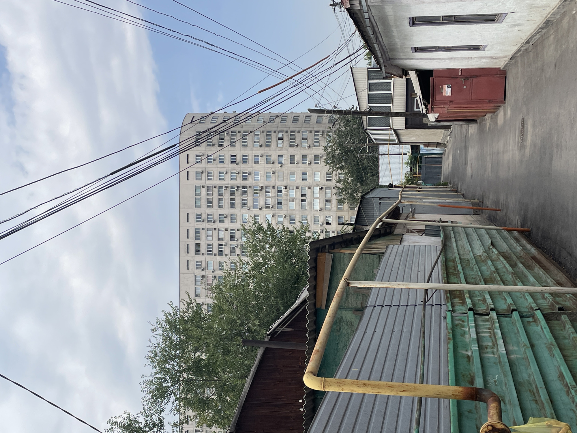 Almaty neighborhood streets and courtyards on a summer morning