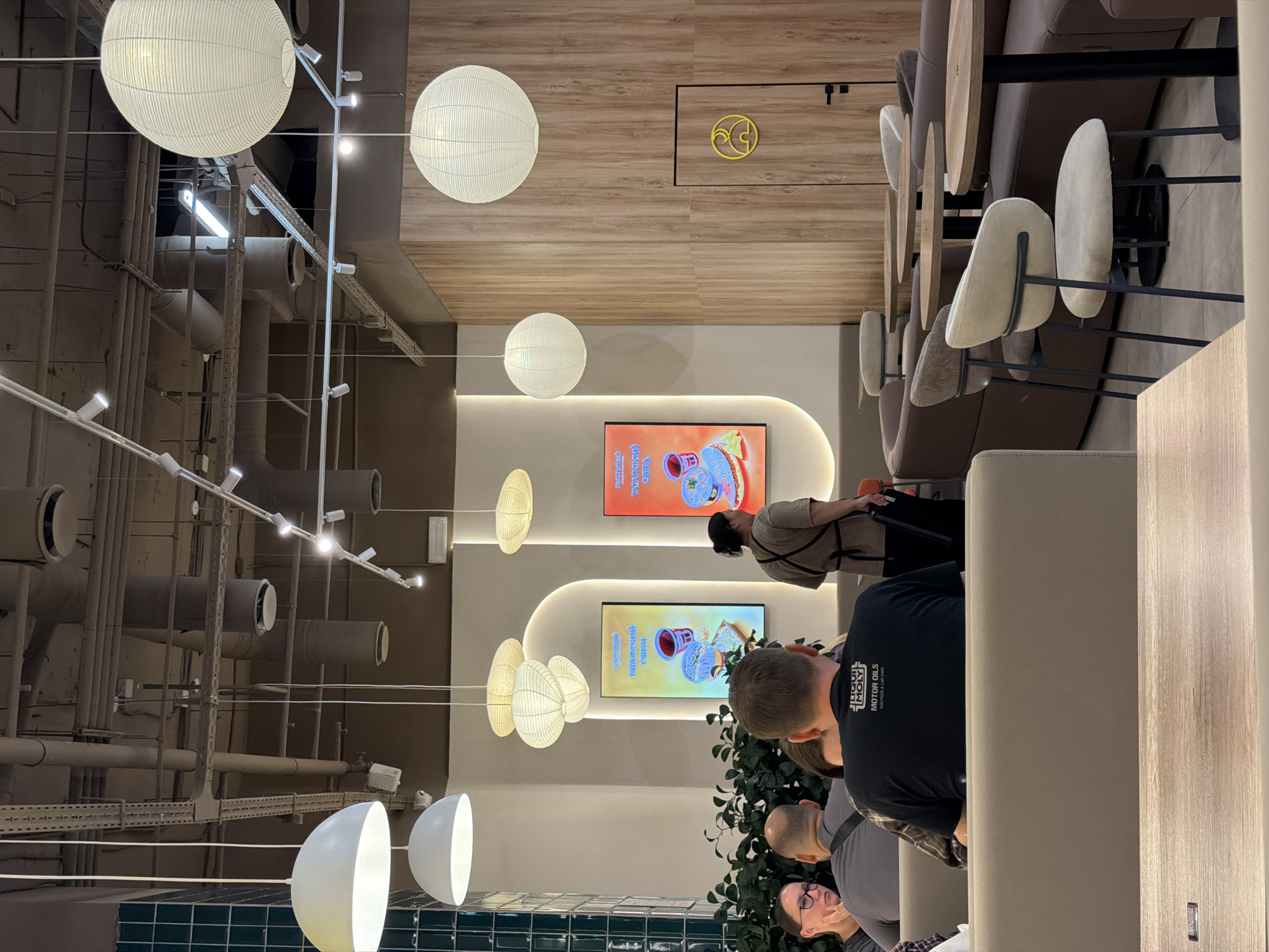 Inside a Kystybyi fast-casual restaurant with Cyrillic menus