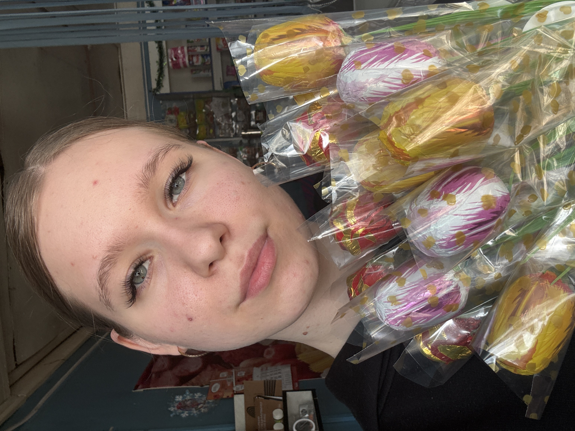 Woman receives chocolate tulip bouquet with meal in Rusalevka