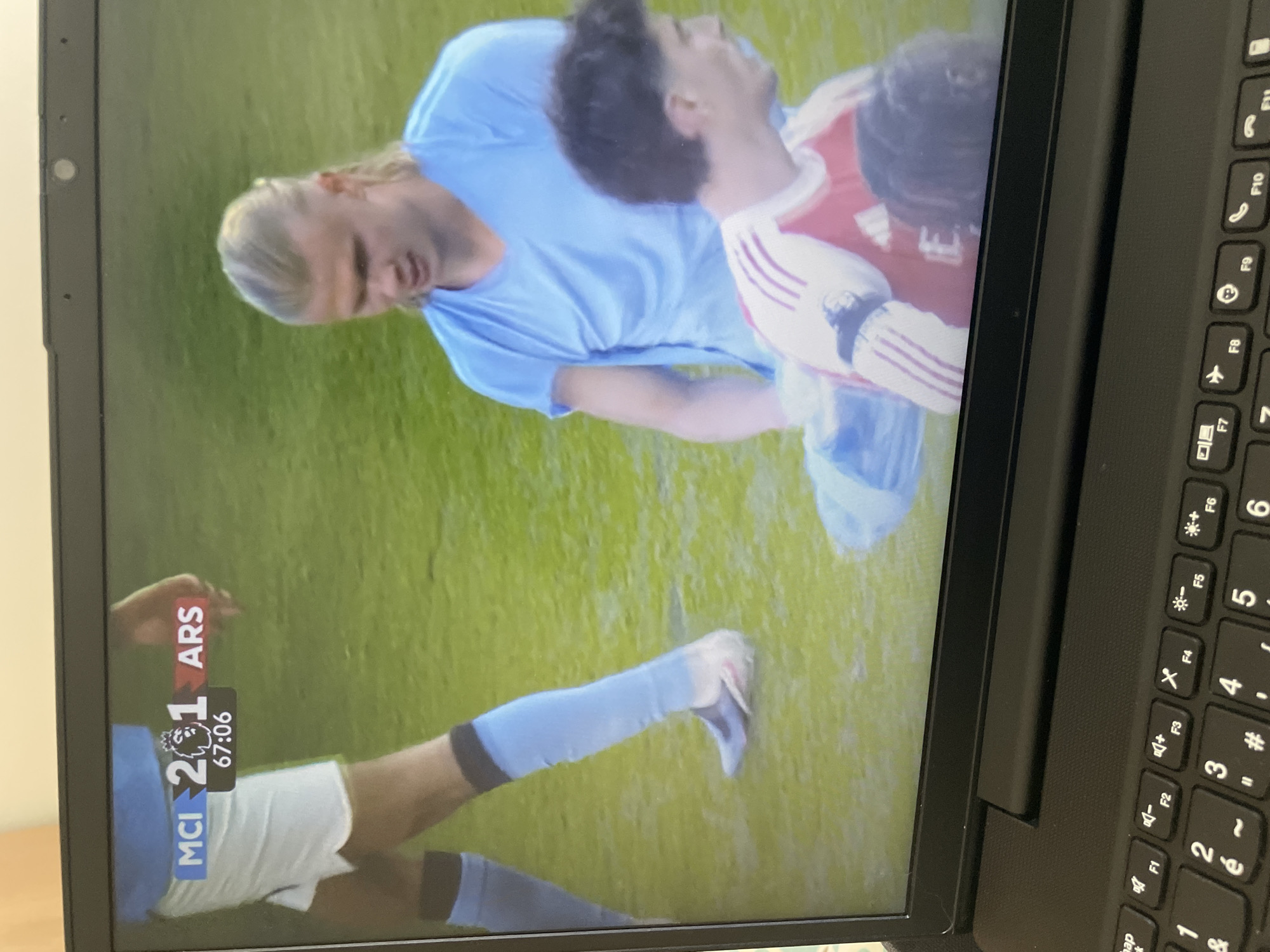 Football match viewed on laptop in Parthenay shows City beating Arsenal