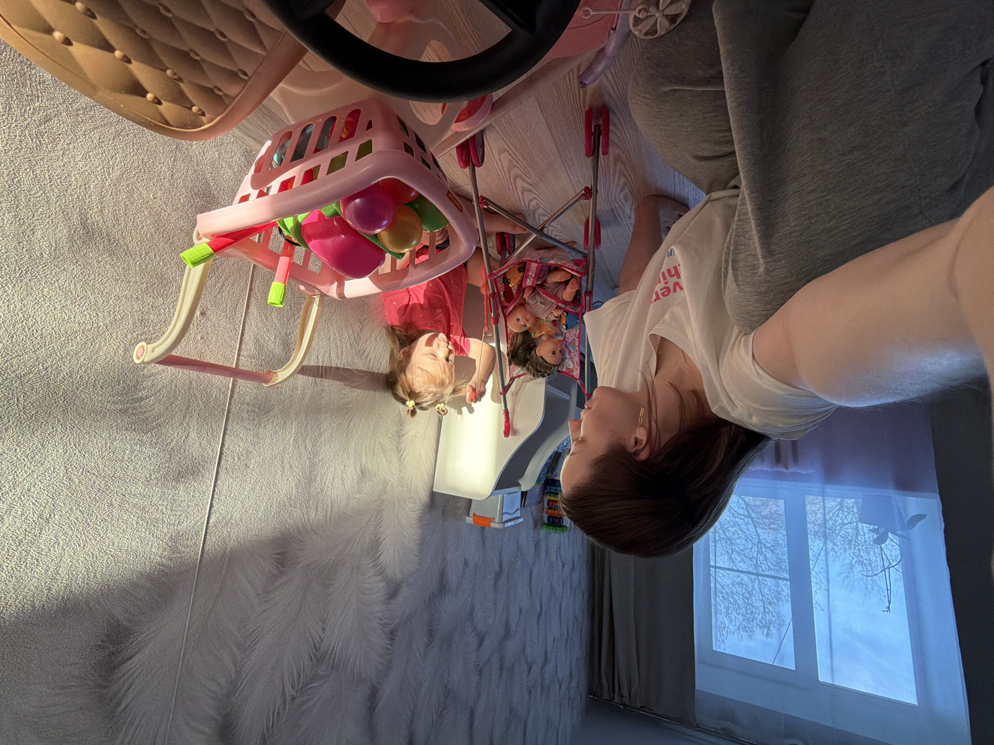 Mother and daughter enjoy toy playtime in Reshetnikovo home