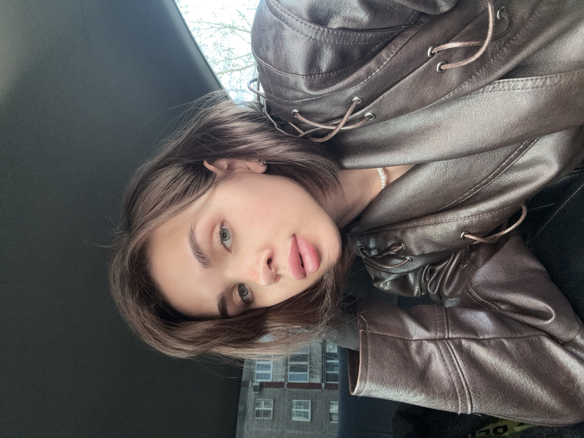 Woman photographed at multiple locations in Perm during afternoon