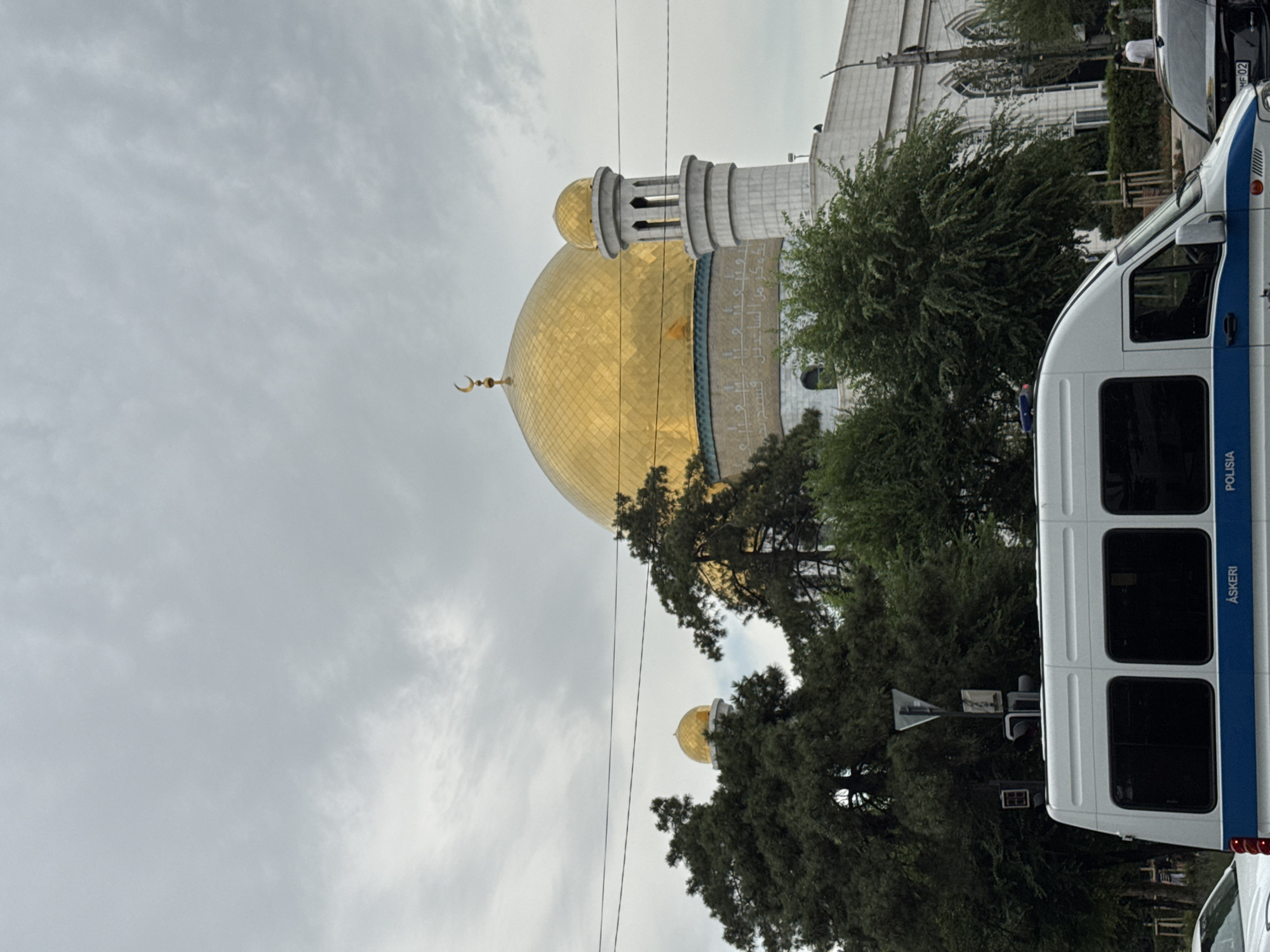 Street-level views around Almaty's Central Mosque on a cloudy morning