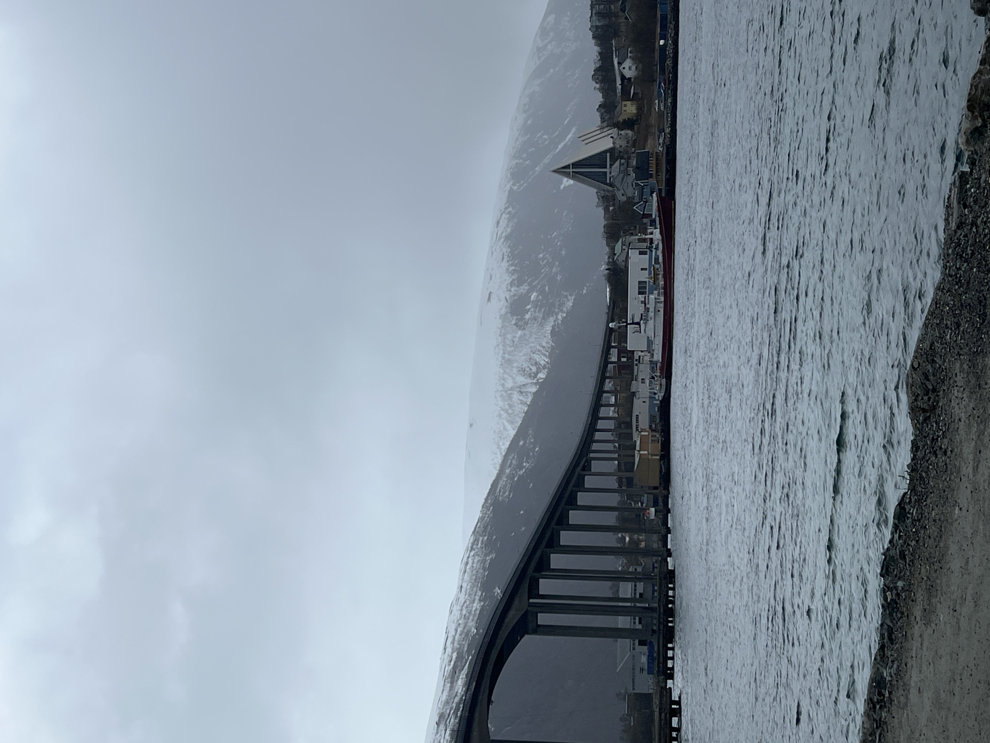 Overcast day captured around Tromsø Bridge and city waterfront
