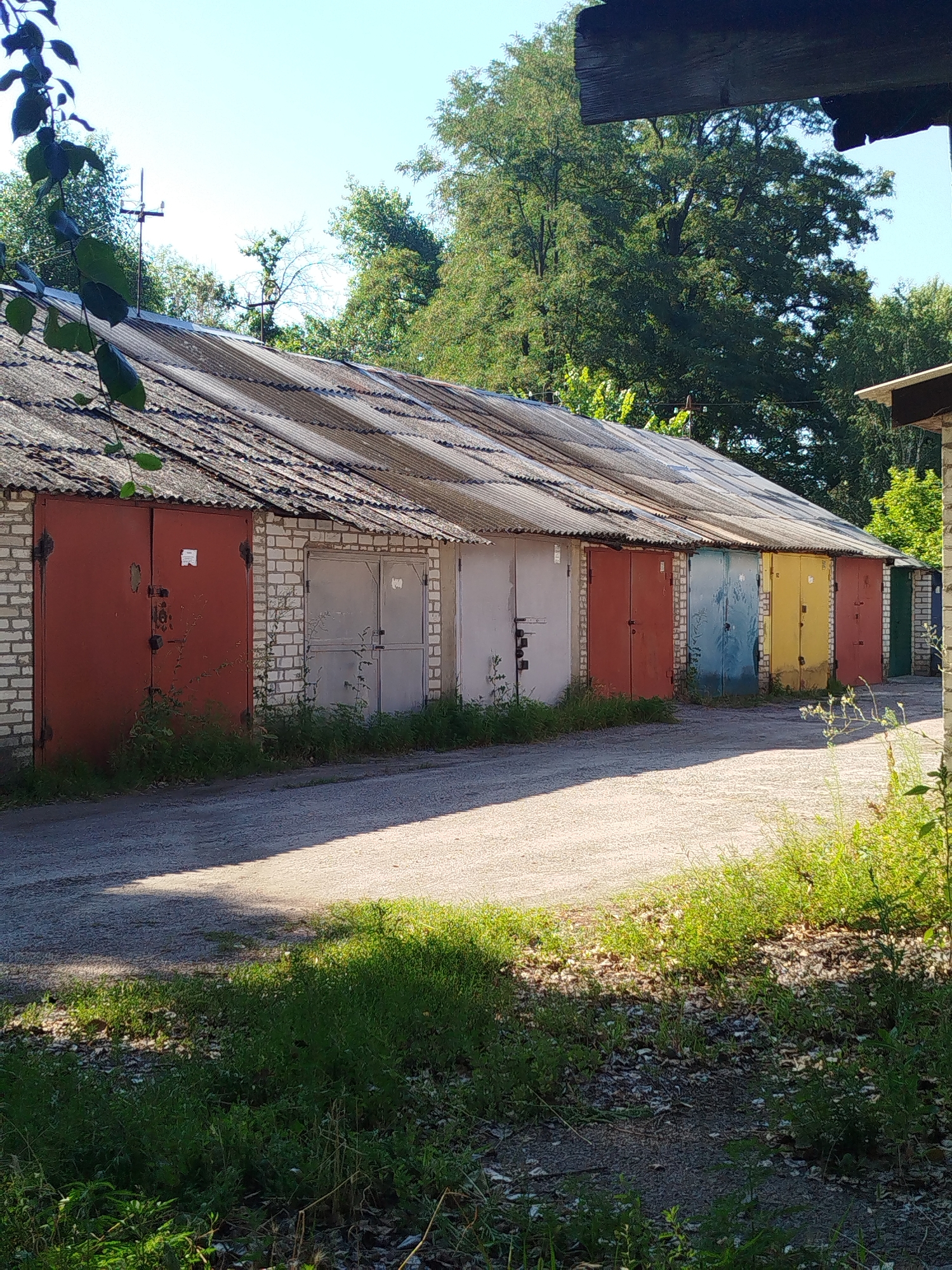 Colorful garage cooperative along a dirt road in Kremenchuk