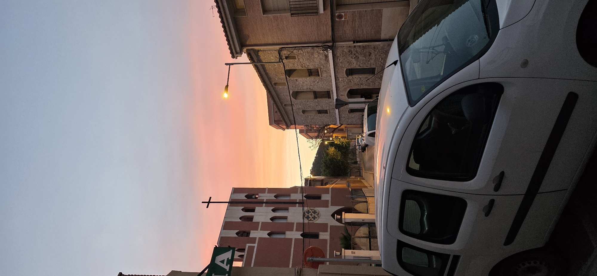 Vibrant sunset colors observed over Sagunto street