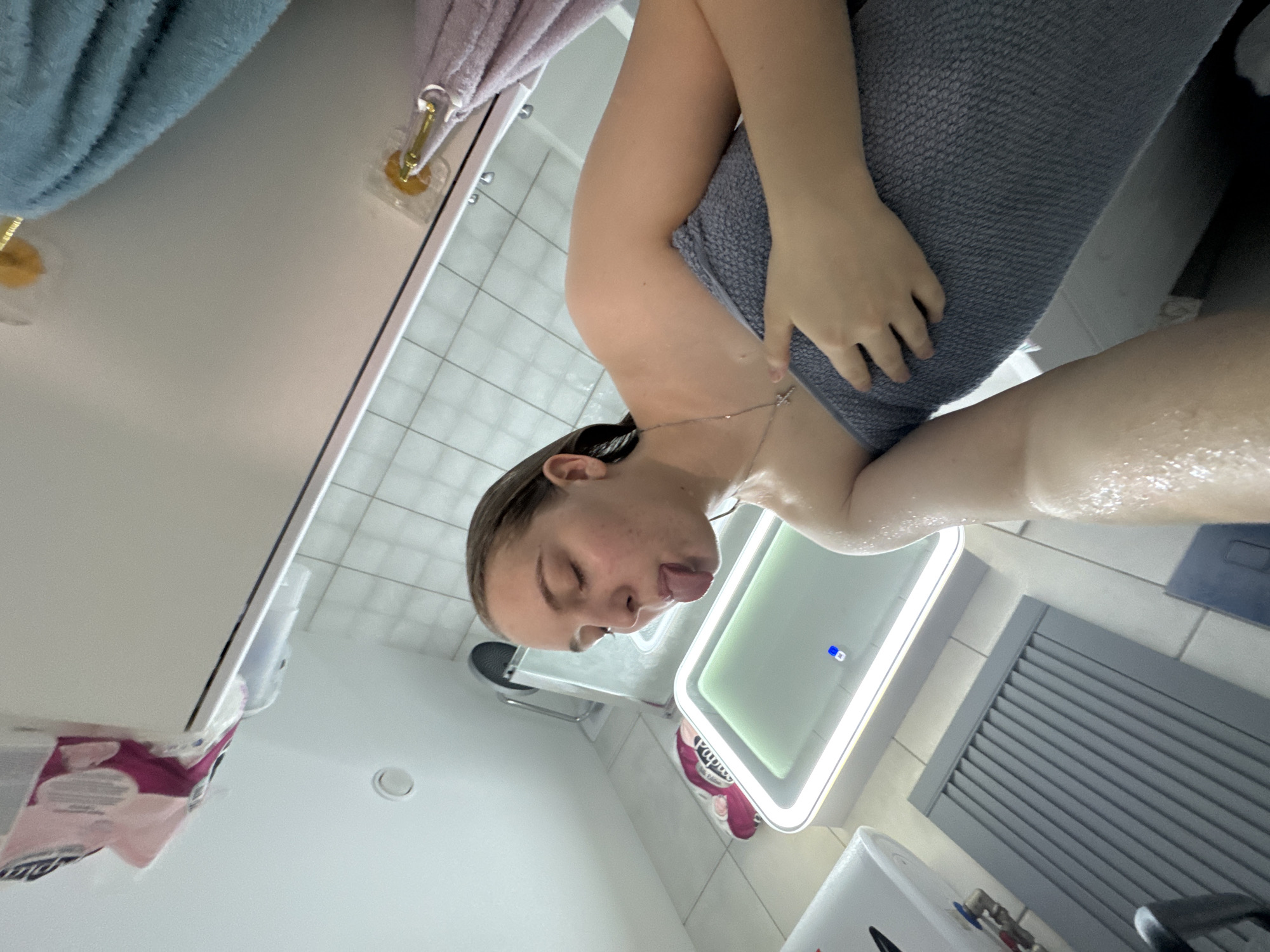 Woman documents post-shower routine in Perm bathroom selfies