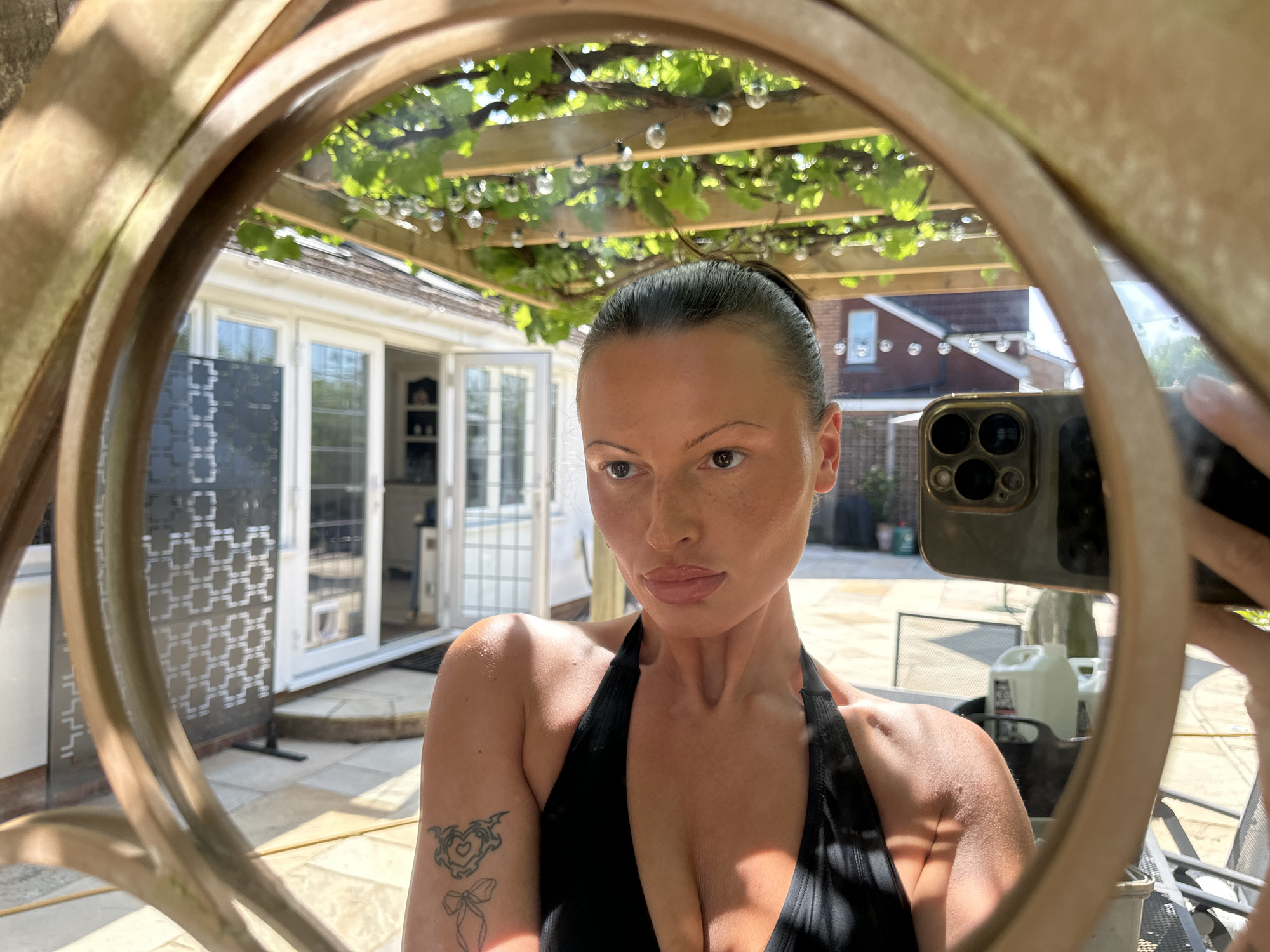 Woman takes morning selfies on Tunbridge Wells patio