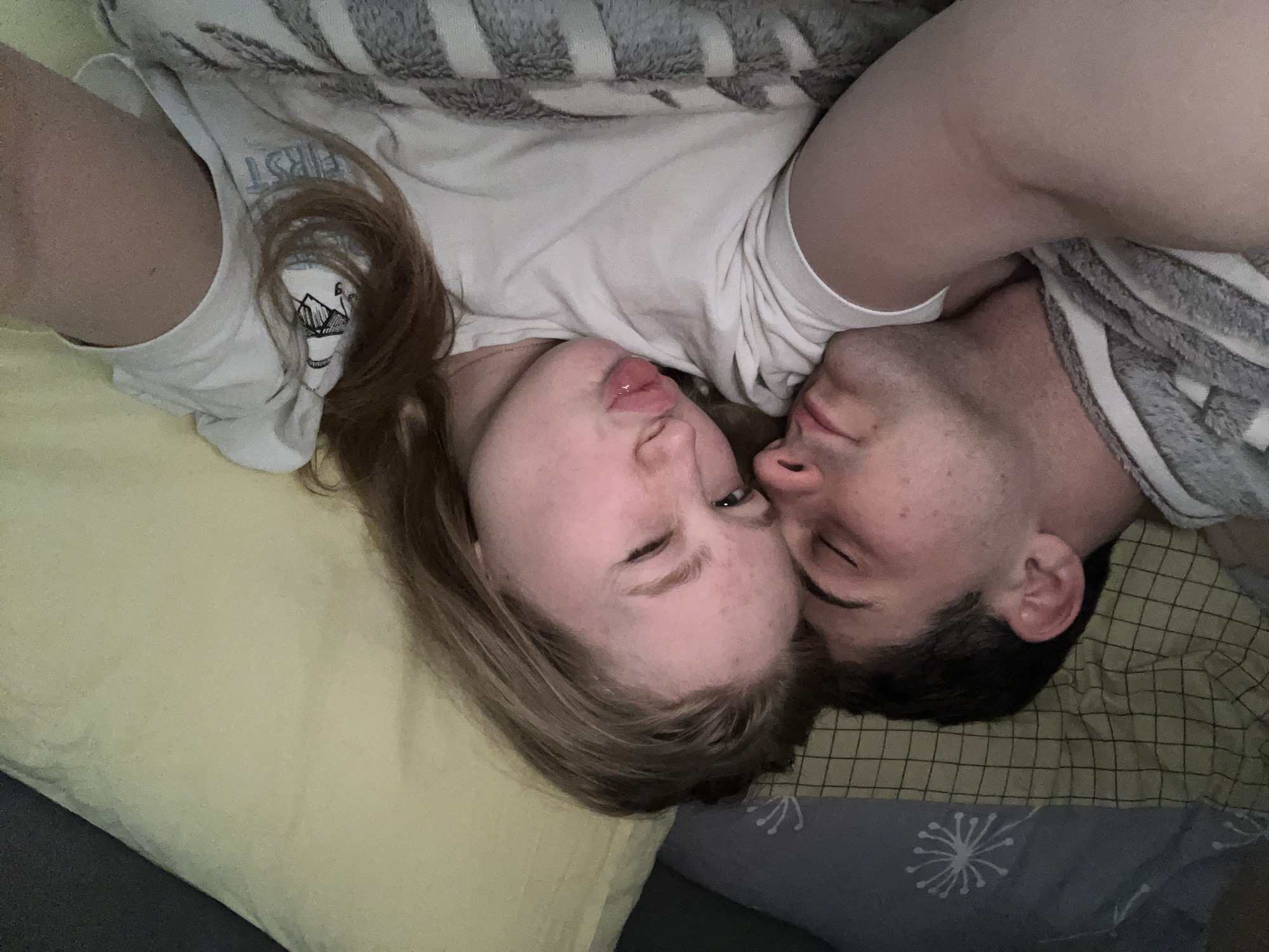 Intimate moment captured between couple in Yuzhny bedroom