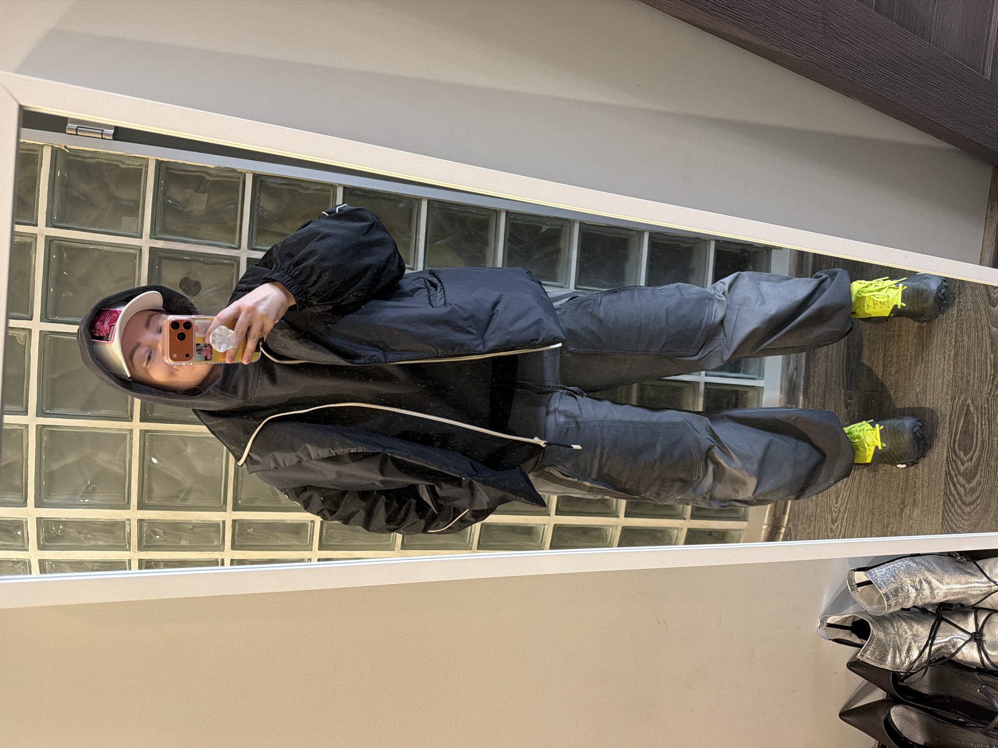 Person takes mirror selfie in Moscow apartment