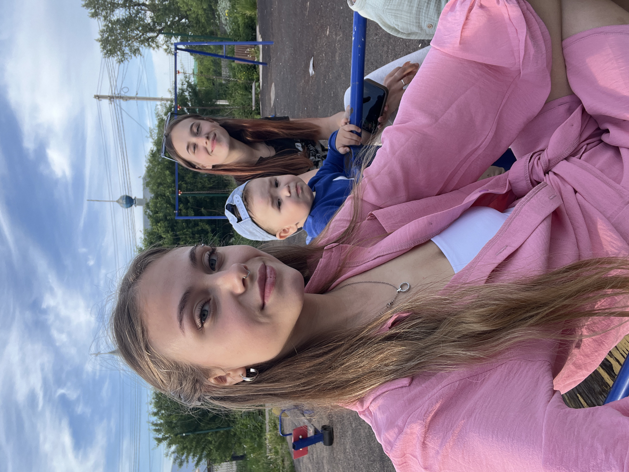 Family playground outing documented in rural Russian village