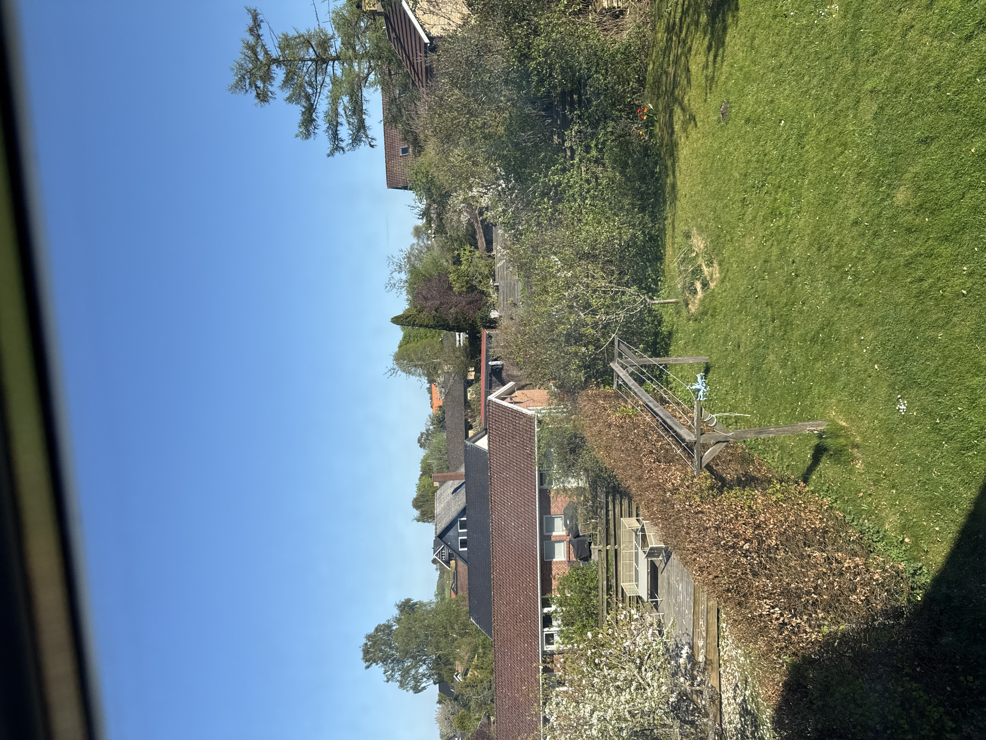 Clear skies observed over suburban Lejre neighborhood from window