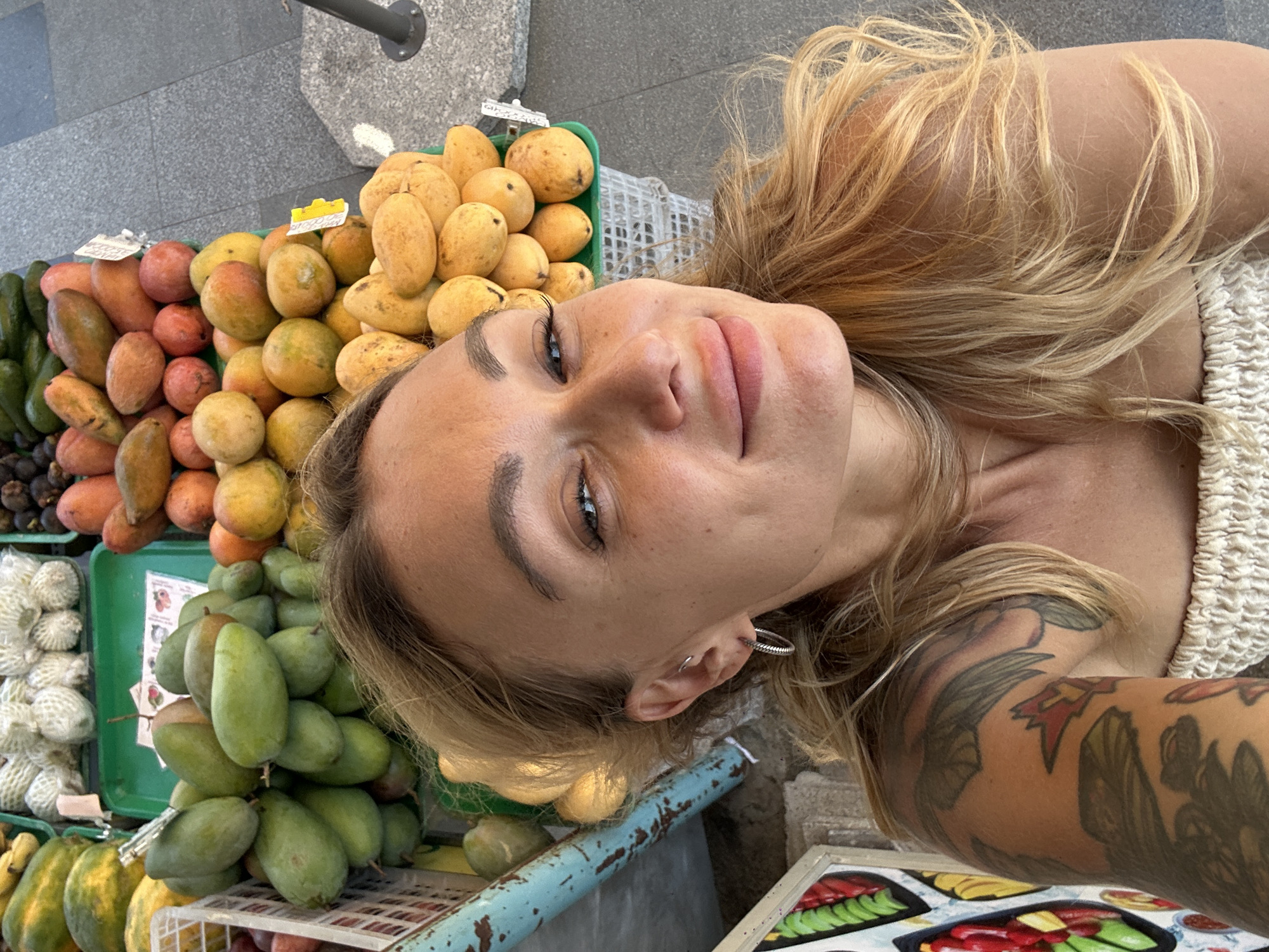 Tourist documents fruit market visit in Vietnam