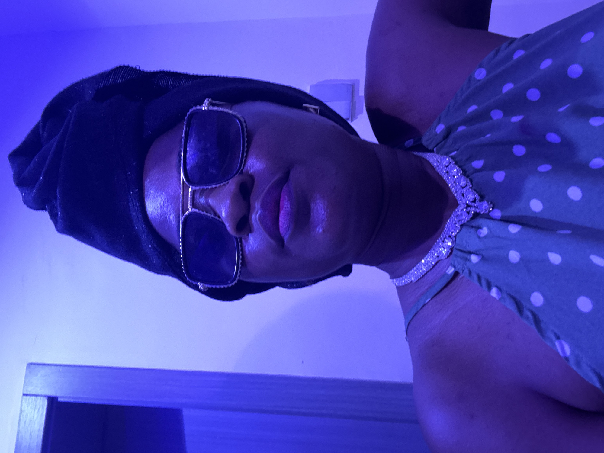 Selfie session in a blue-lit Ajara venue, consistent look throughout.