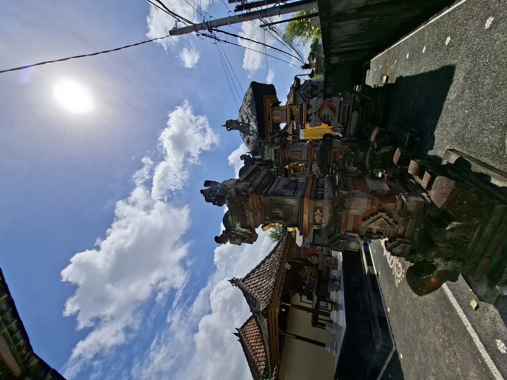 Tourist documents Balinese temple complex and village scenes in Blahbatuh