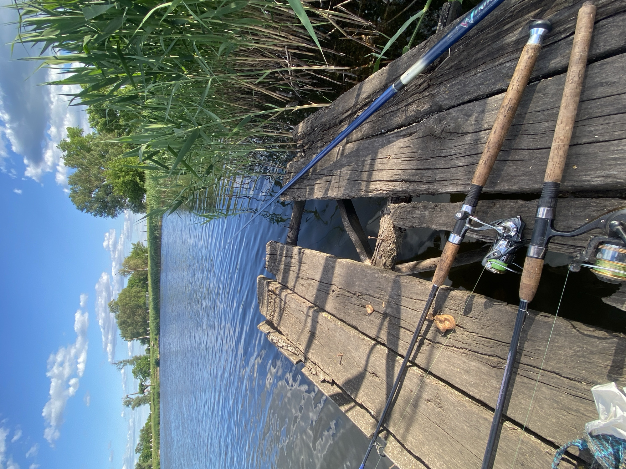 Fishing session documented on wooden dock in Ustyvytsia Ukraine
