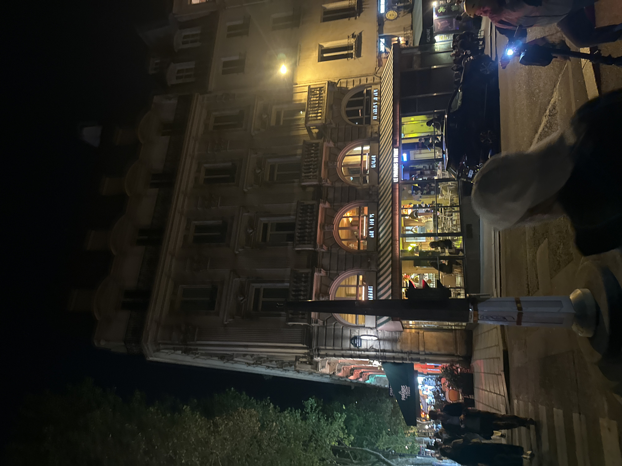 Evening street life continues in central Paris