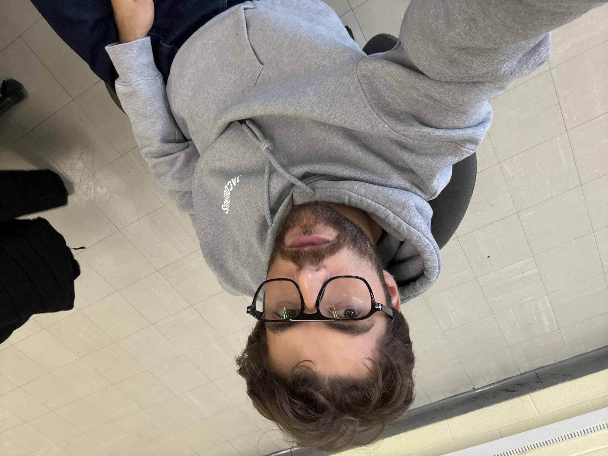 Montreal resident captures multiple selfies in grey hoodie