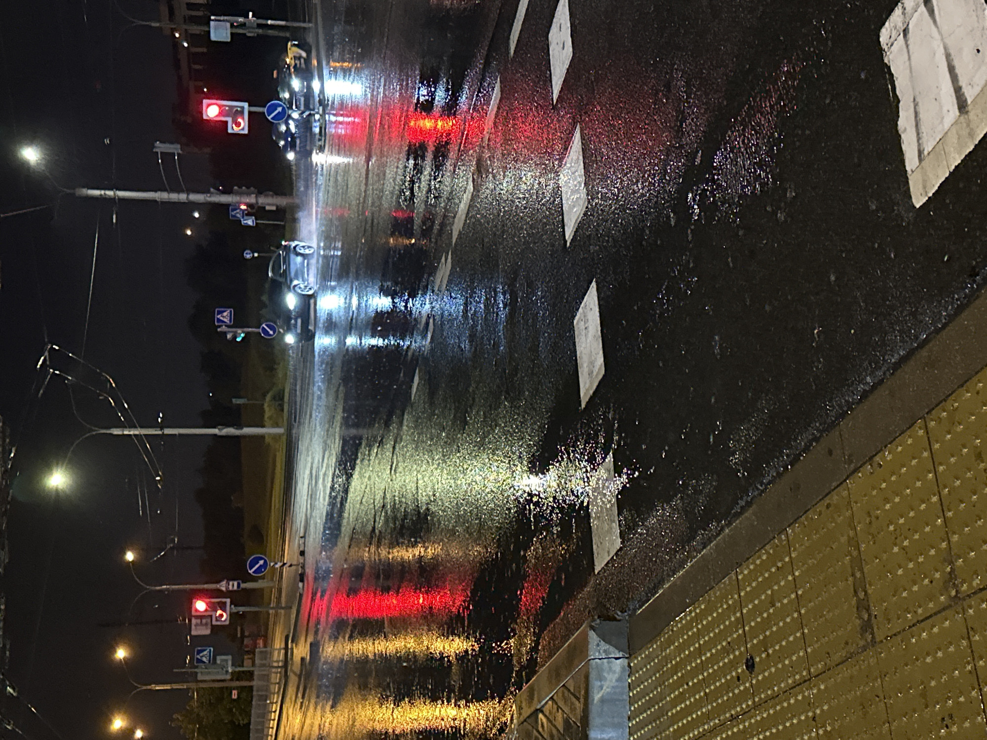 Nighttime bus journey through rainy Minsk streets documented