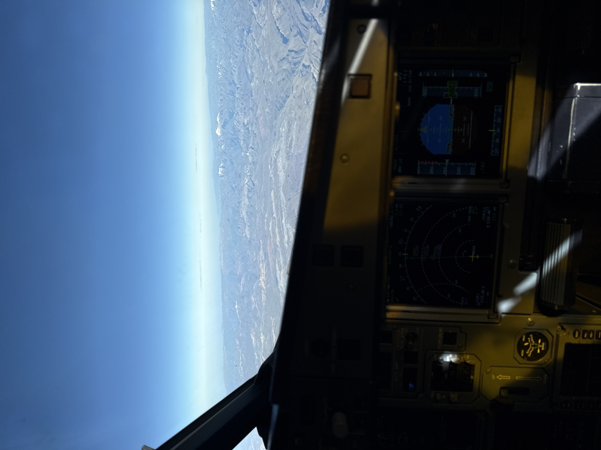 Aircraft flies over mountainous Peru landscape