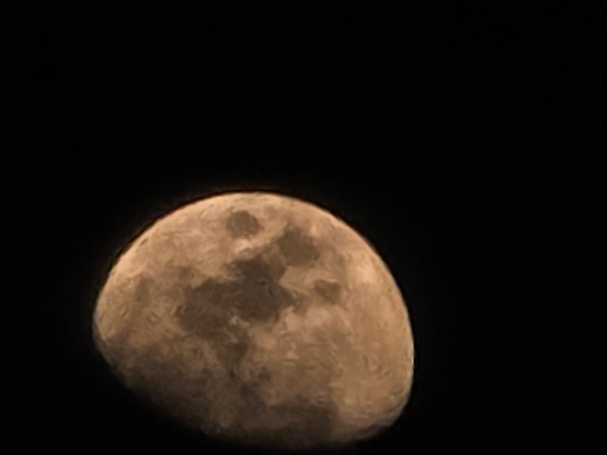 Close-up shots of a gibbous moon, craters visible