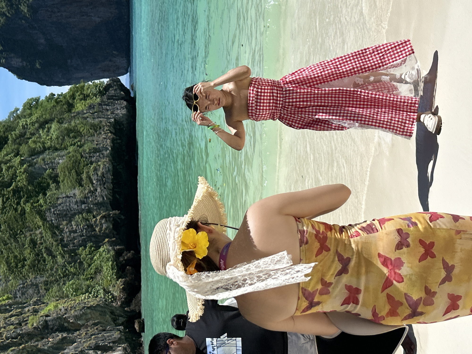 Tourists enjoy scenic morning at Maya Bay, Thailand