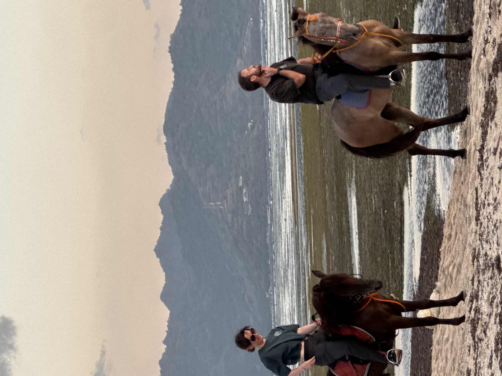 Sunset horseback riding along an Indonesian beach