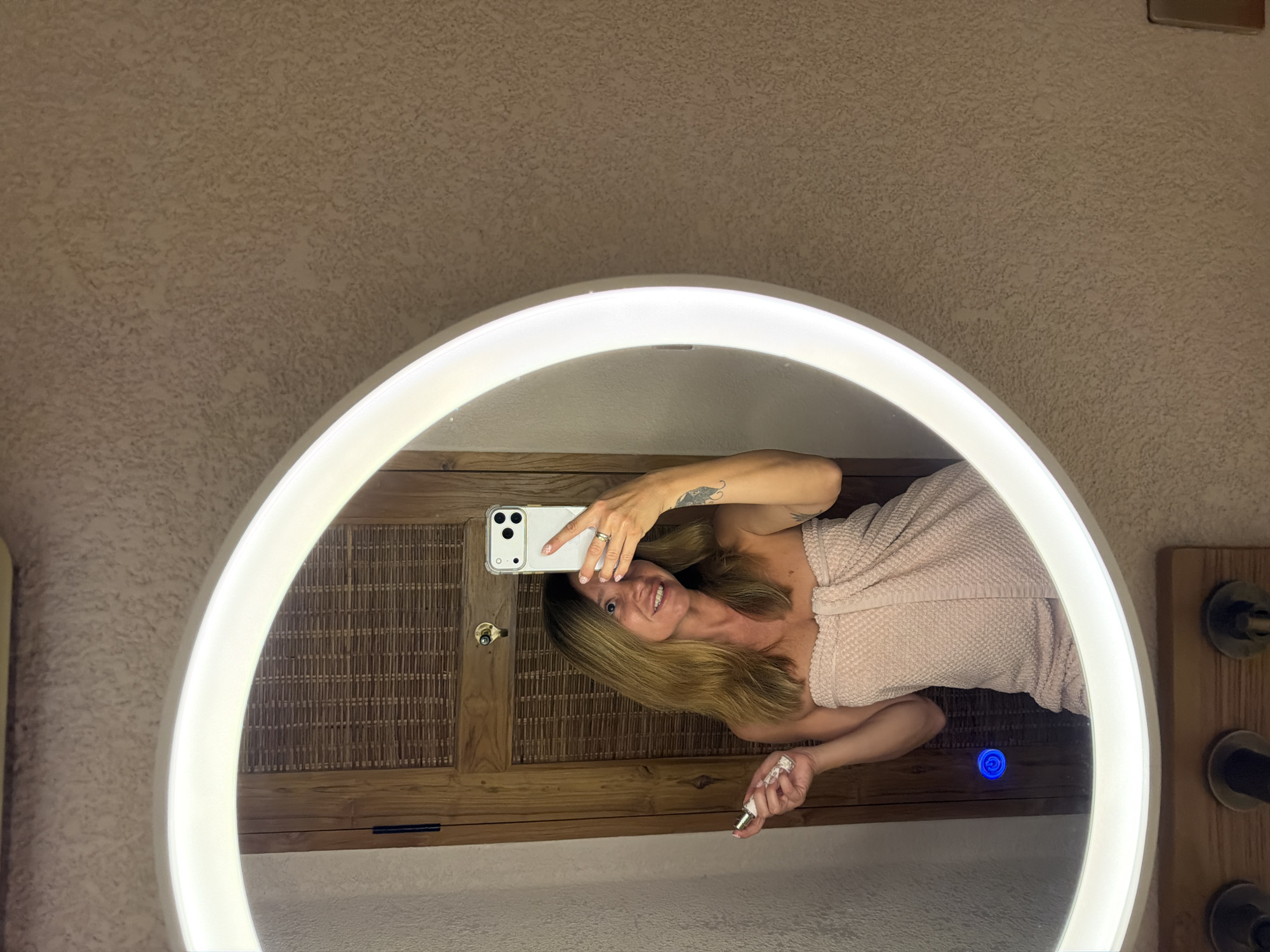 Woman documents skincare routine selfies in Mengwi bathroom