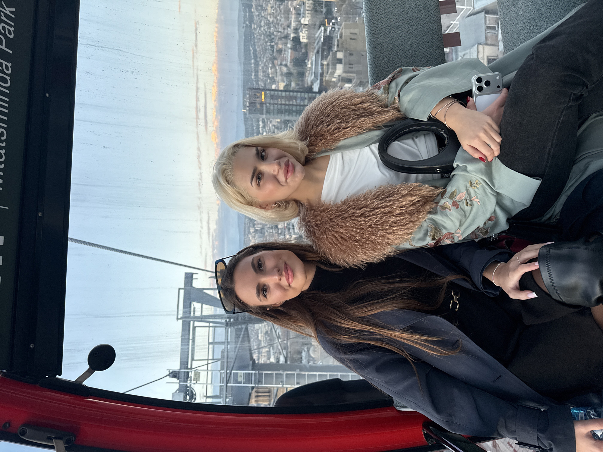 Women ride cable car gondola above Tbilisi