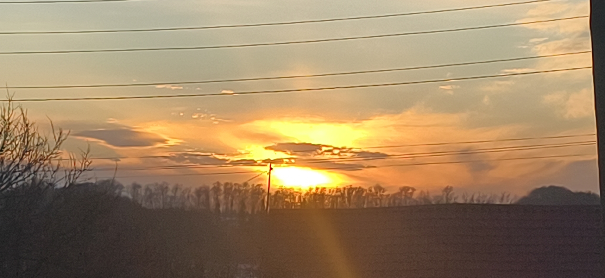 Sunset documented through power lines in Foki, Russia