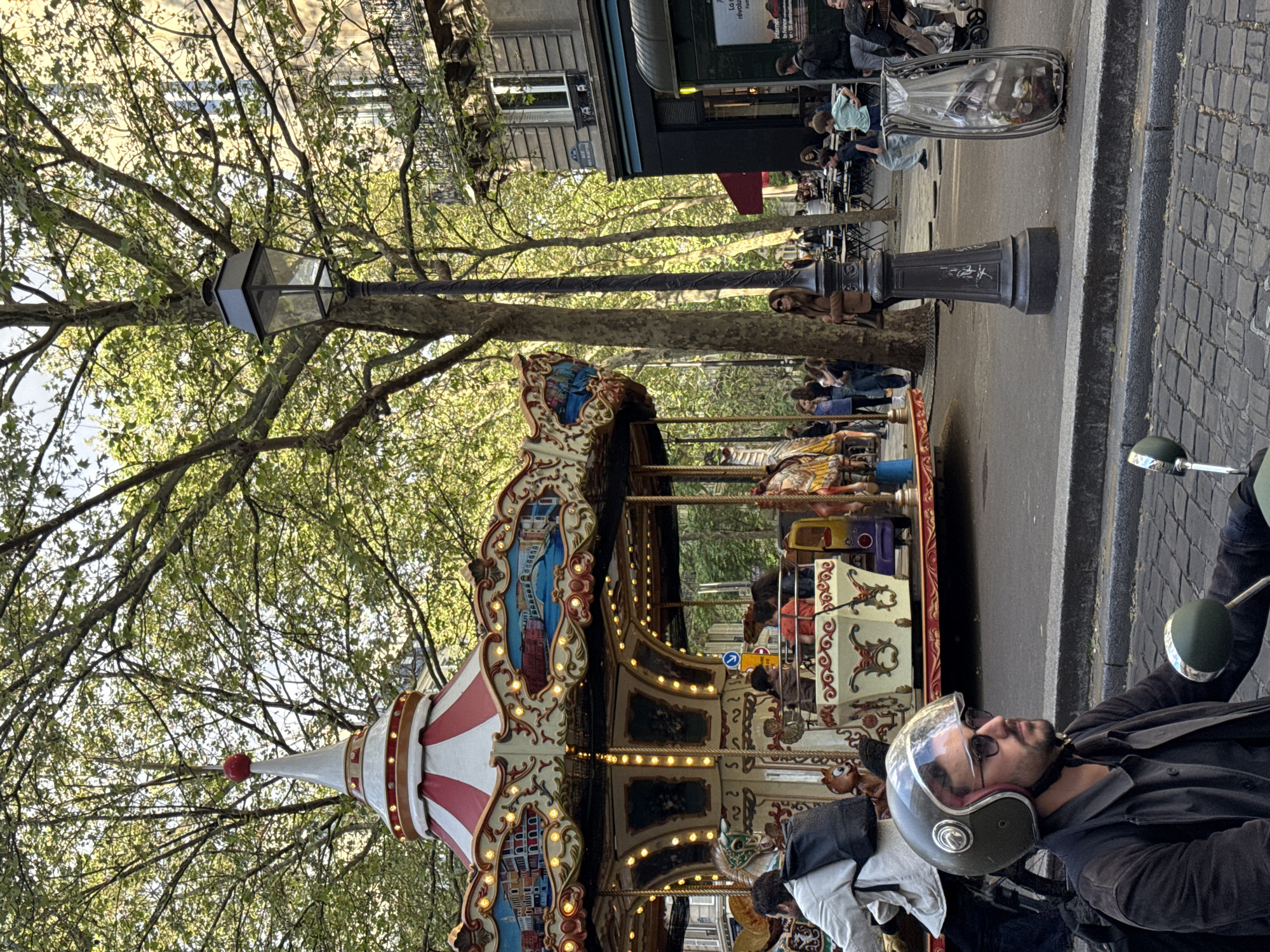 Afternoon street life documented across central Paris neighborhood