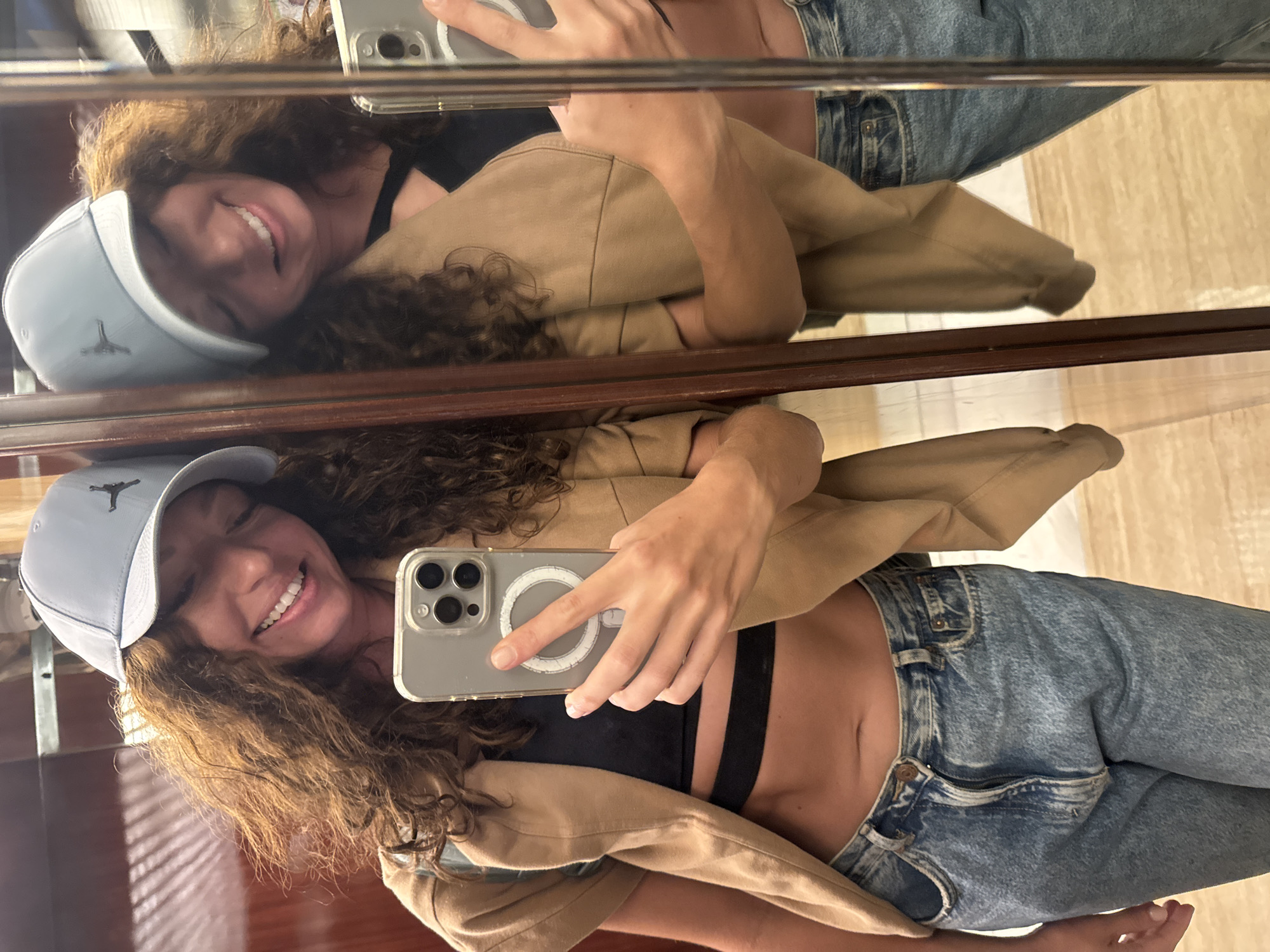 Woman takes mirror selfies in Đà Nẵng hotel room
