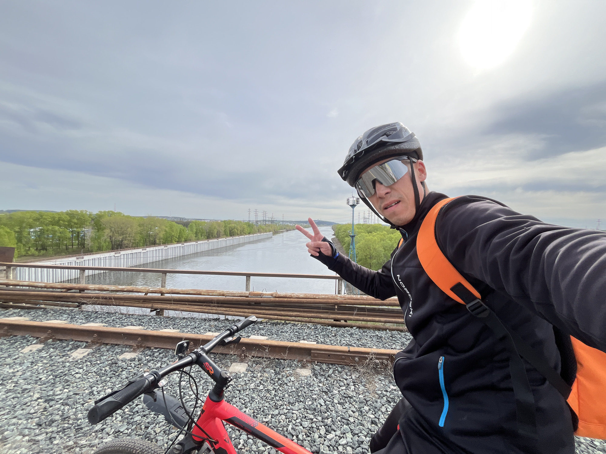 Cyclist takes selfie on railroad tracks in Chaikovsky, Russia