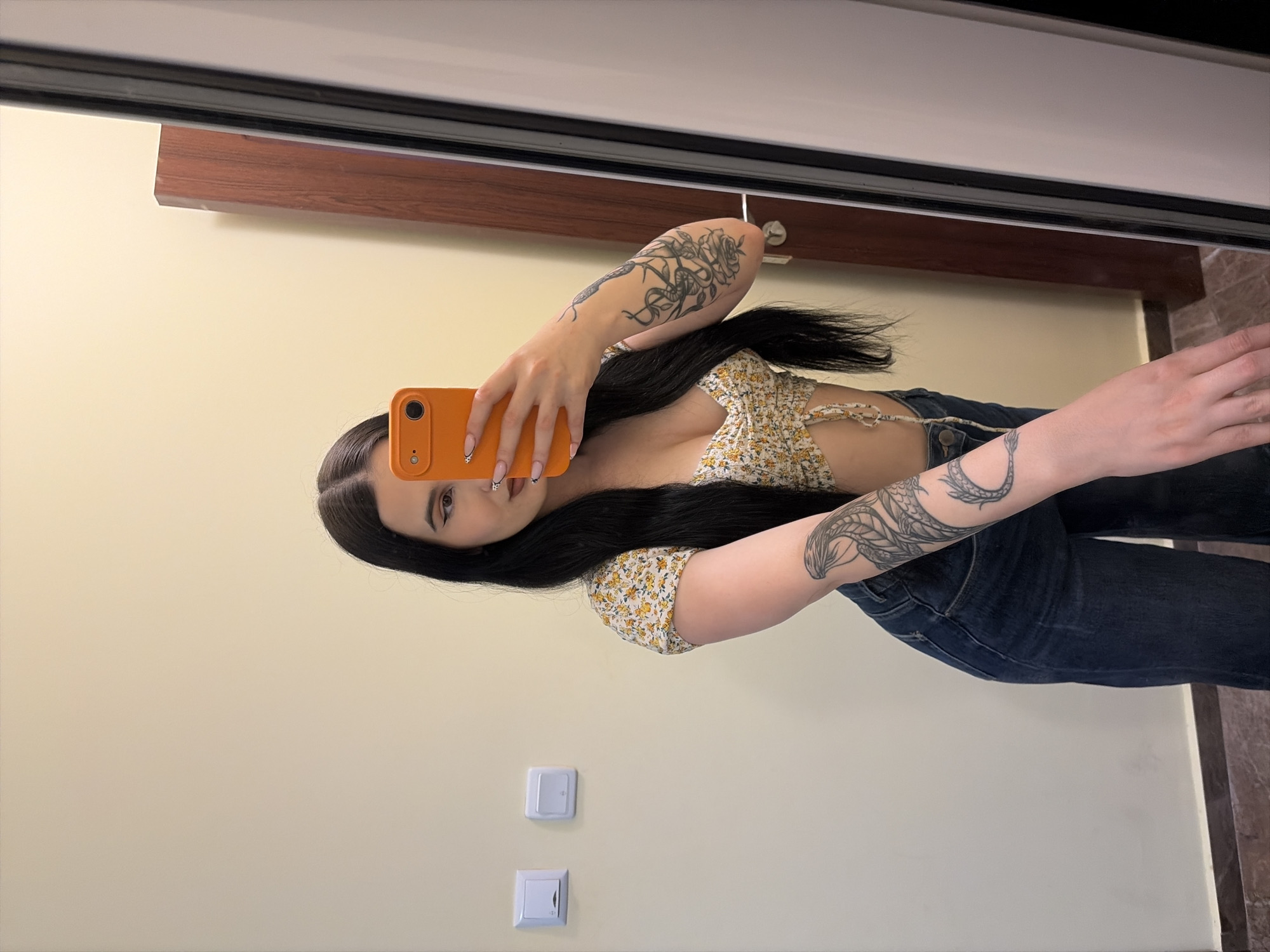 Woman takes mirror selfie in Sofia apartment