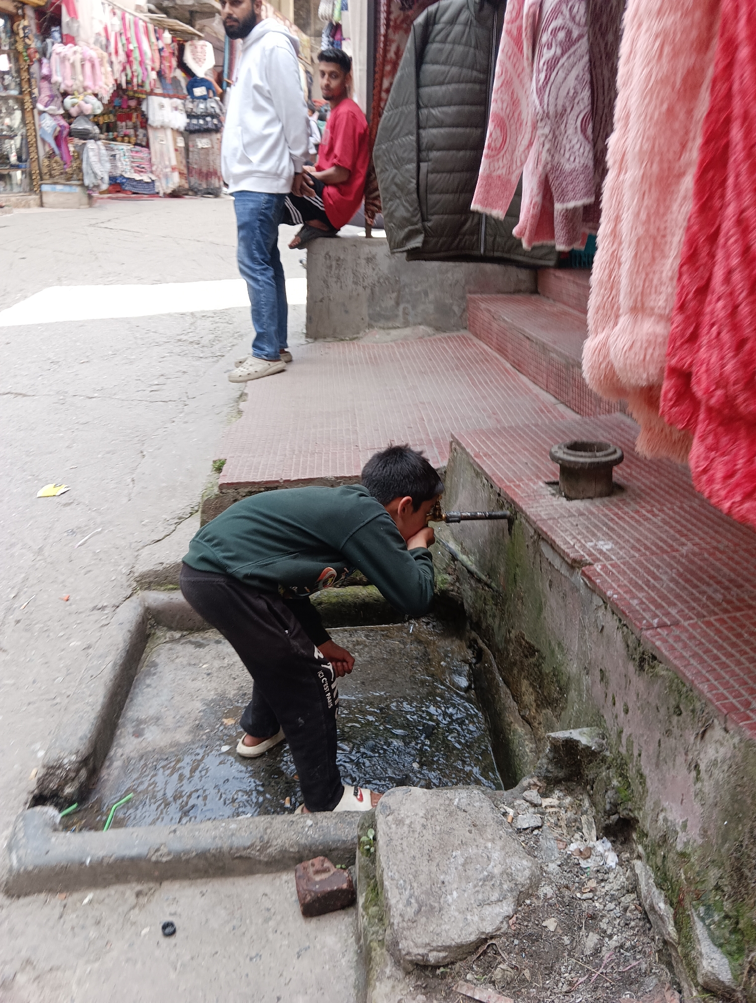 Street life, nature, and architecture in a mountainous town