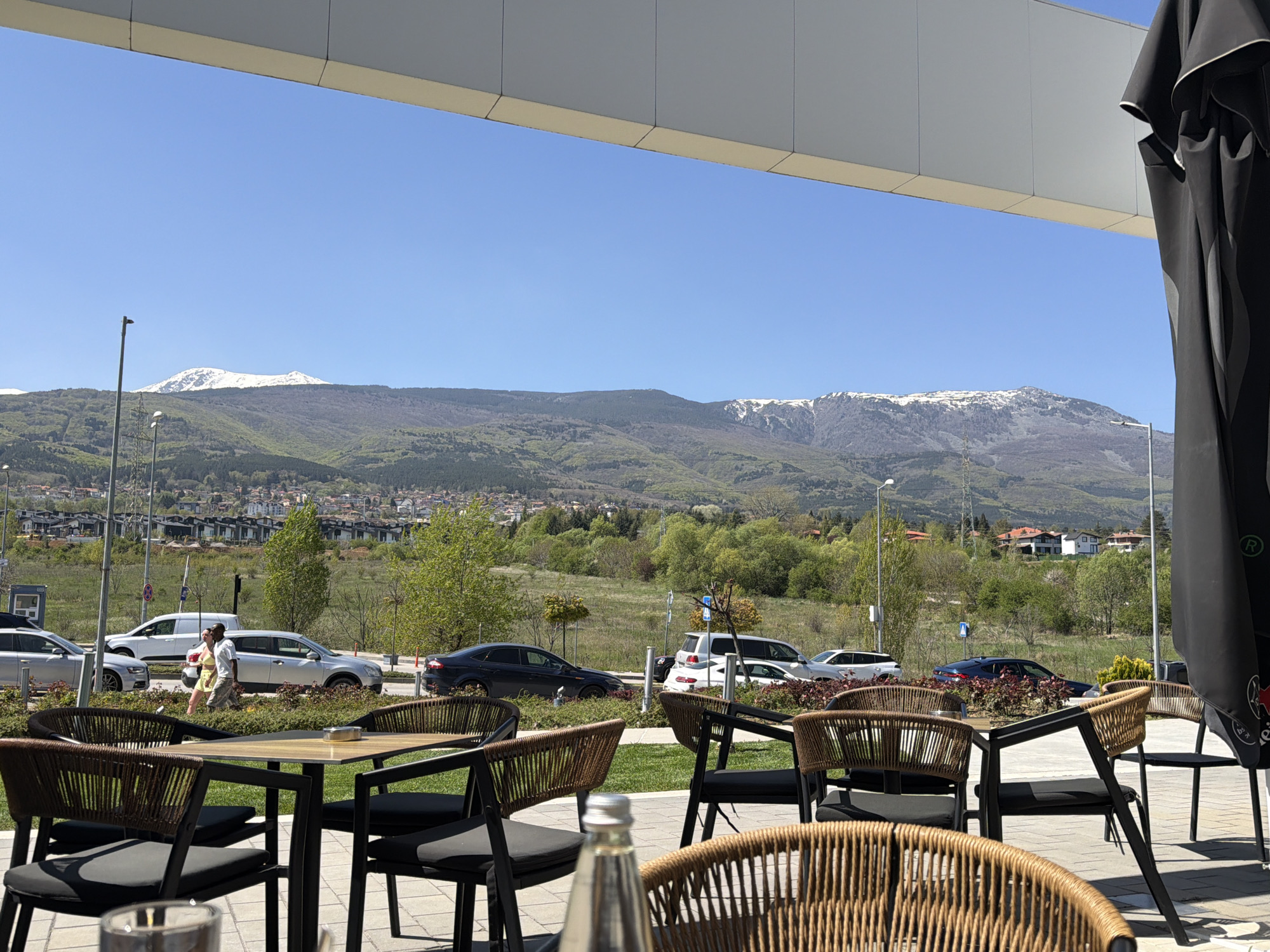 Morning cafe scene captured with mountain views in Sofia