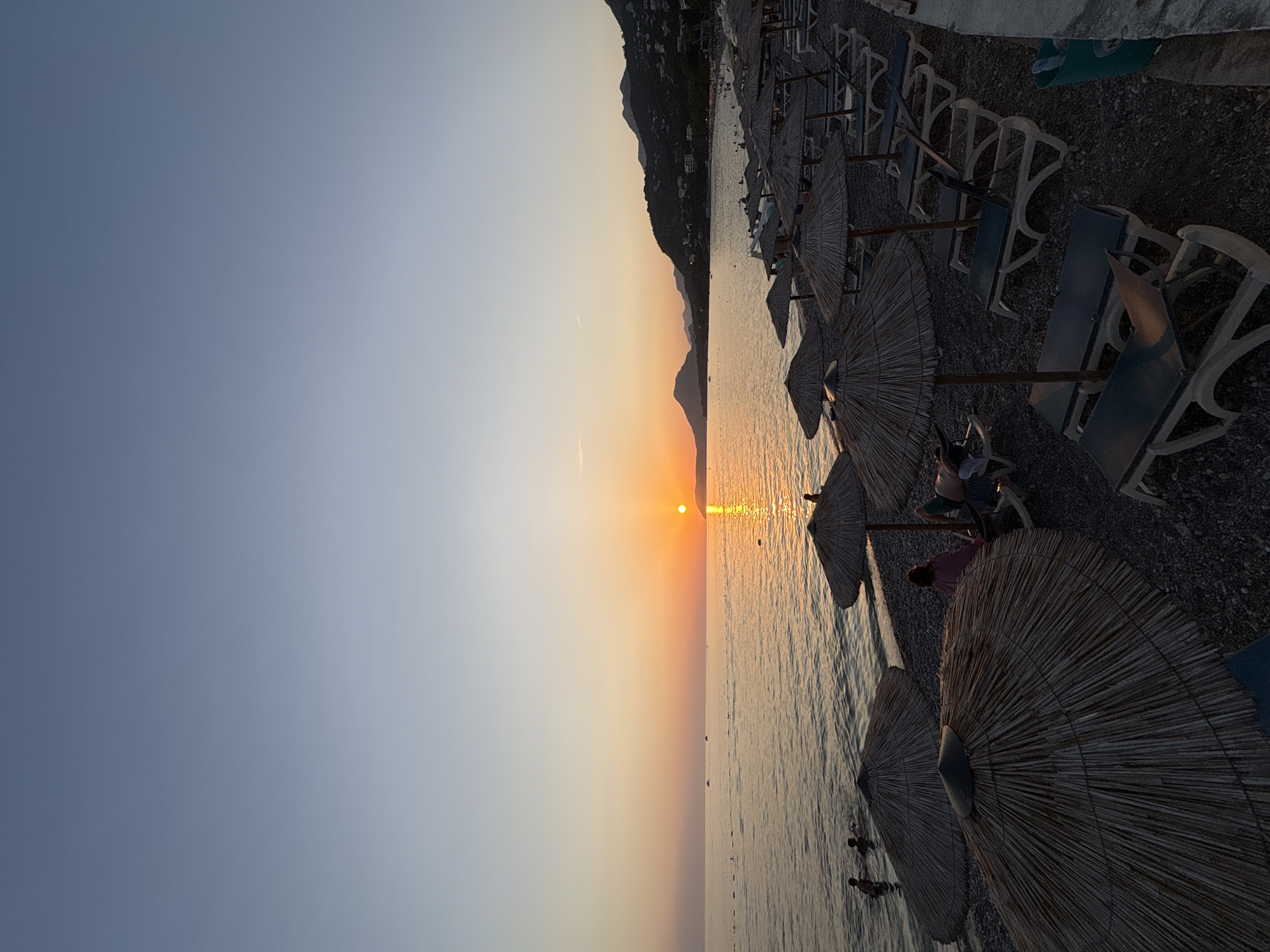 Golden hour settling over Bar's pebble beach, Montenegro