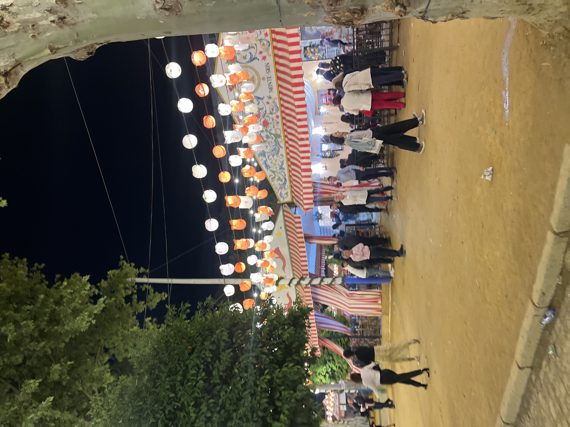 Nighttime Feria de Abril celebrations documented in Seville streets