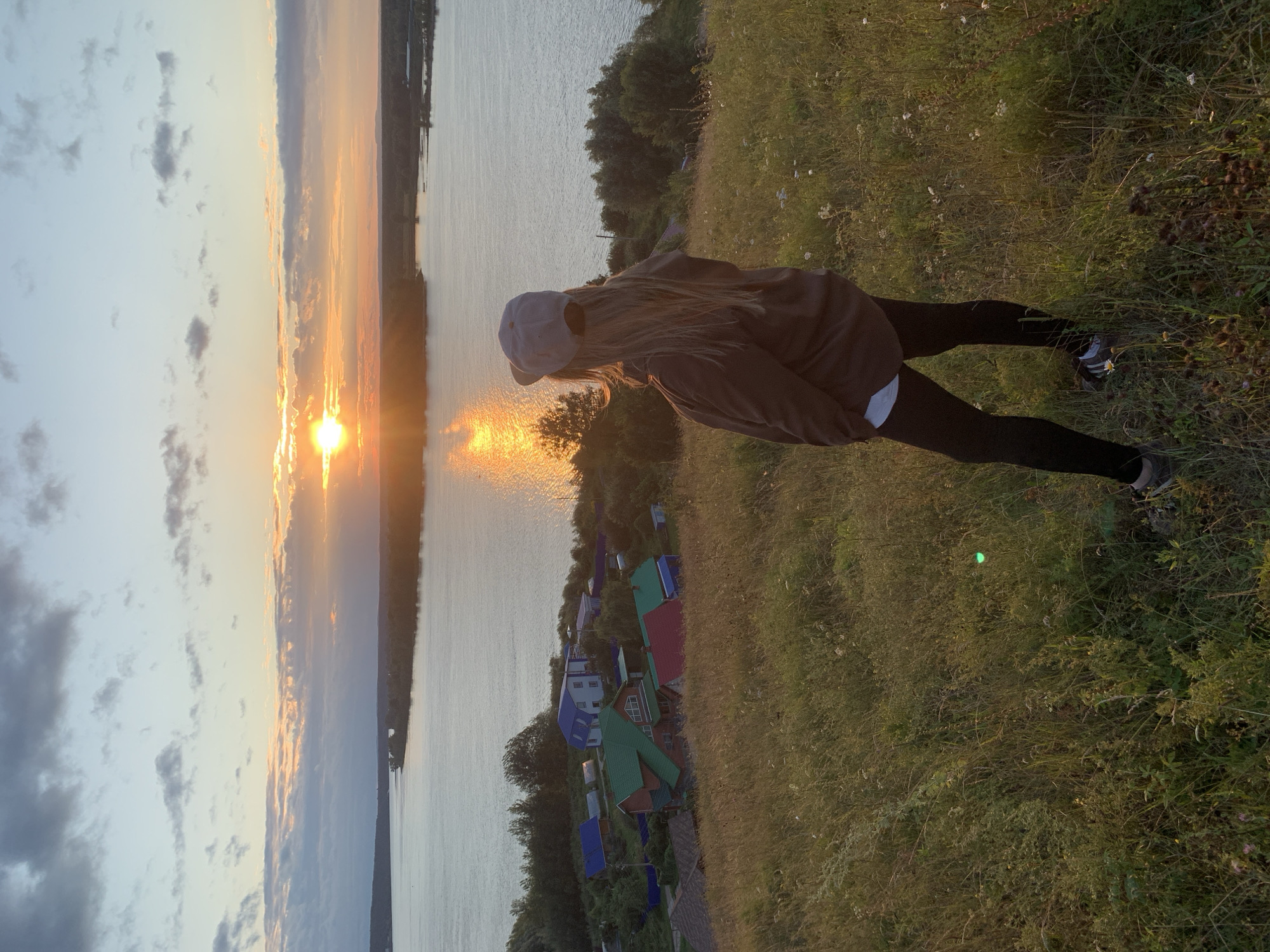 Sunset on the riverbank in Olkhovka, late summer evening