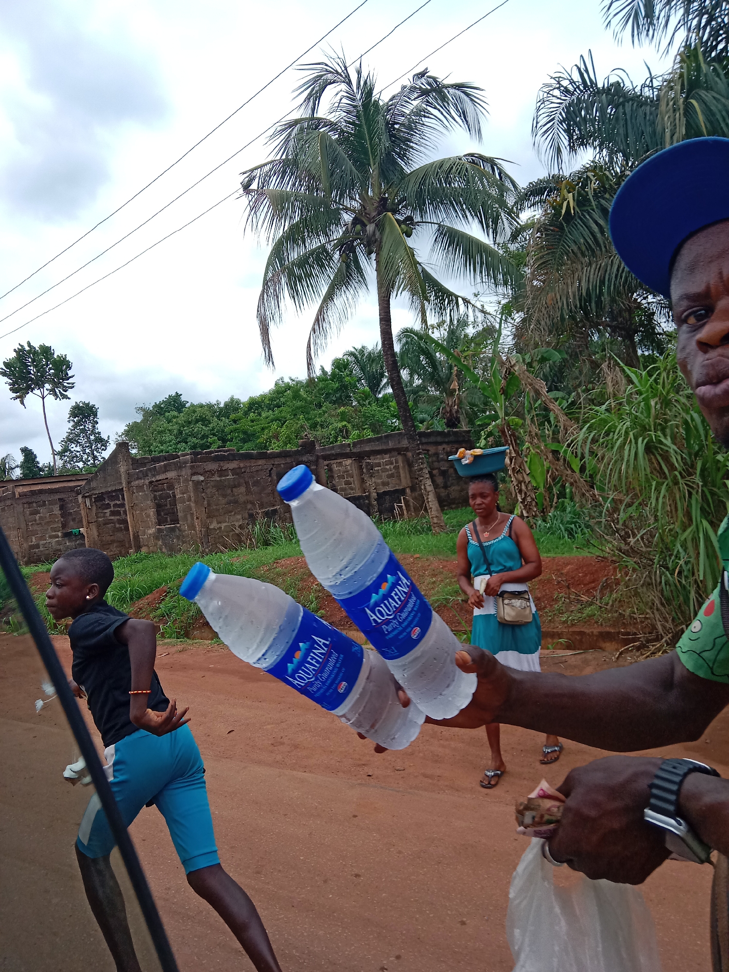 Man with water bottles observed on Oji River road