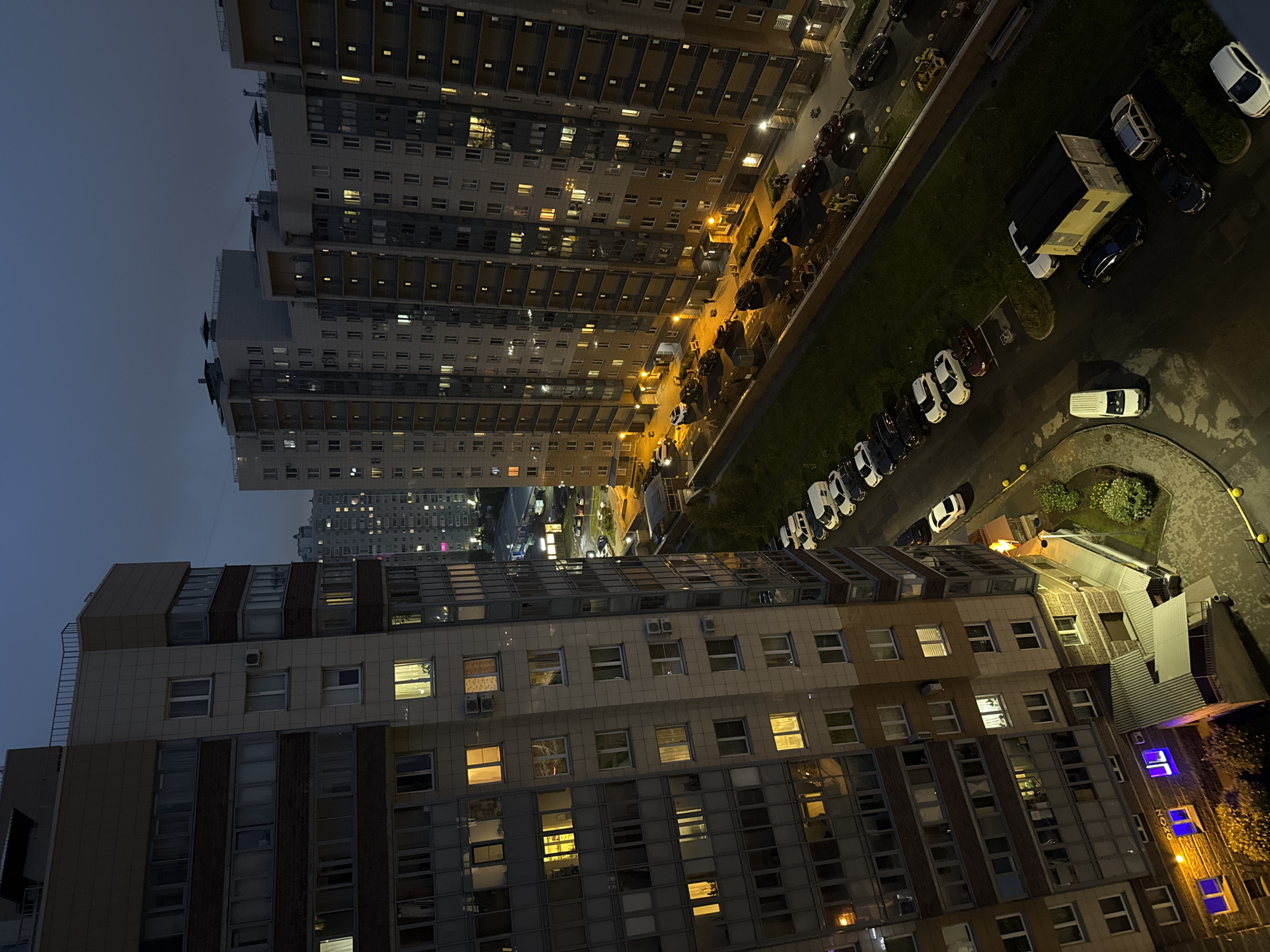 Evening view of illuminated apartment buildings in Russia