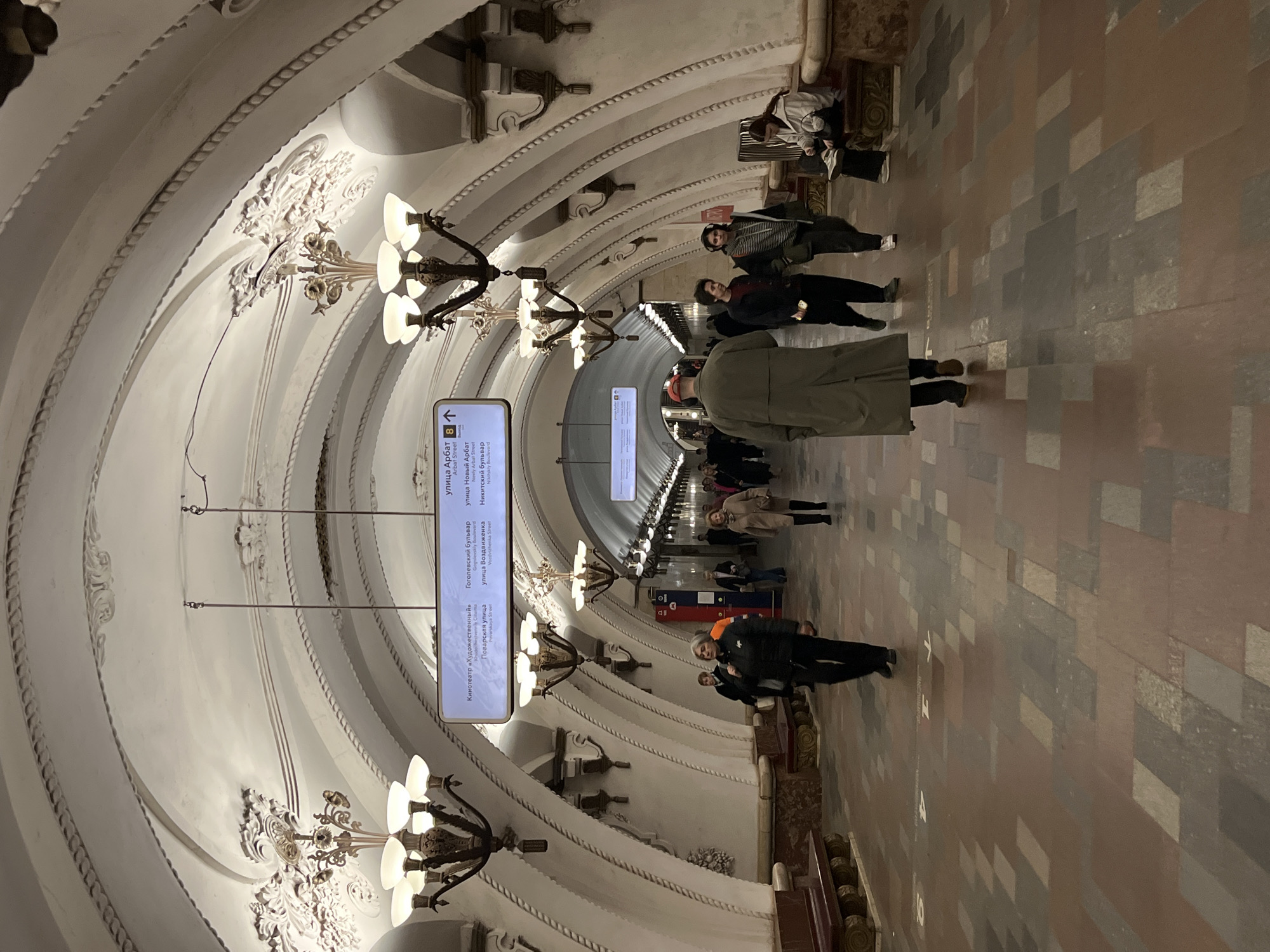 Moscow tourists document metro station and Kremlin sightseeing