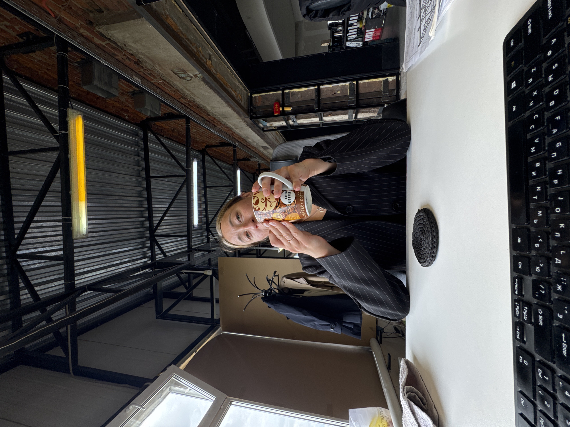 Woman photographed at work, taking selfie in Chaikovsky office
