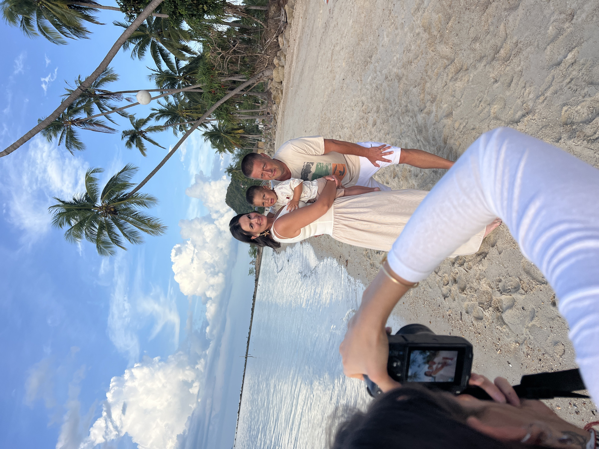 Family photography session documented at Baan Tai beach Thailand