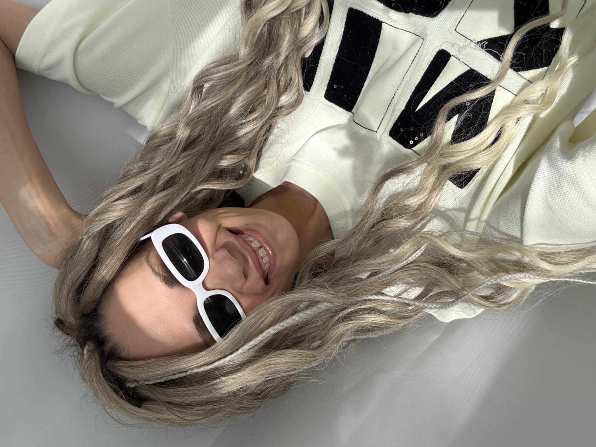 Woman relaxes indoors wearing sunglasses in Rusanovo, Russia