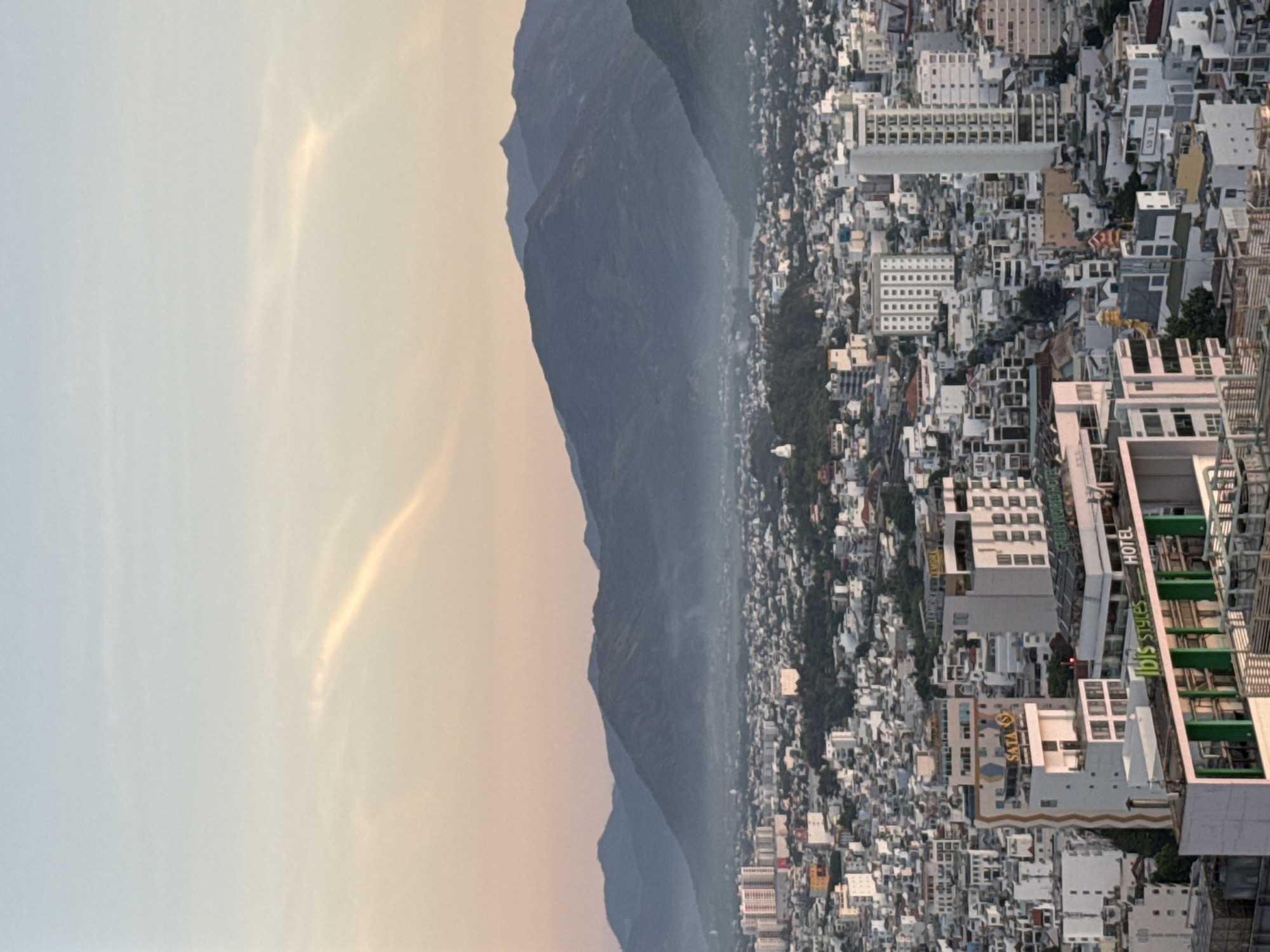 Dusk views over Nha Trang's skyline, coast, and mountains